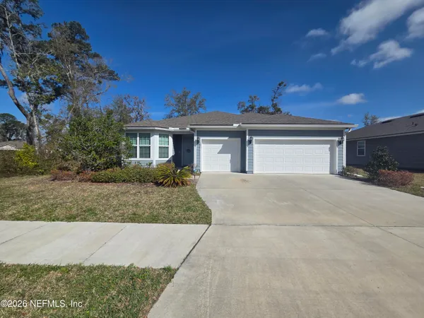 front view of a house with a yard