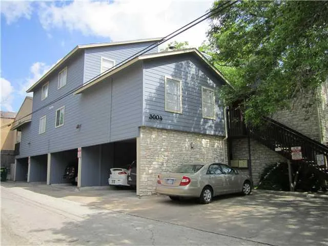 a car parked in front of a house