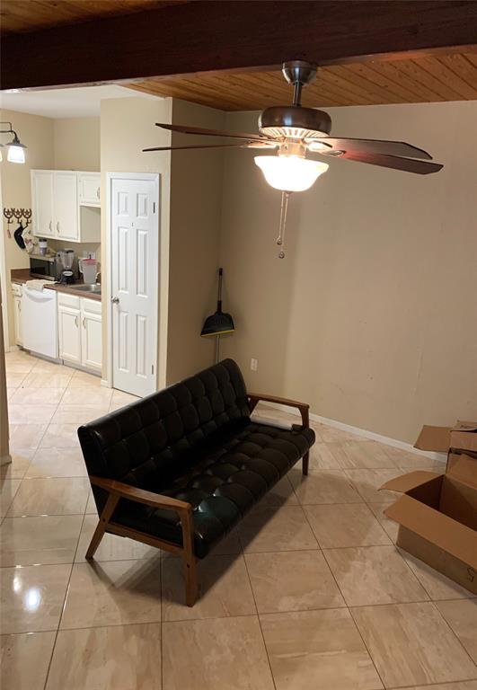 3004 Speedway, Unit 103 Austin, TX 78705 - Photo 3 of 9 a living room with a table chairs and a chandelier