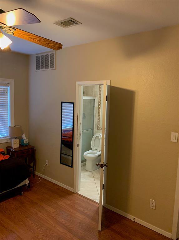3004 Speedway, Unit 103 Austin, TX 78705 - Photo 7 of 9 a view of a livingroom with wooden floor and closet