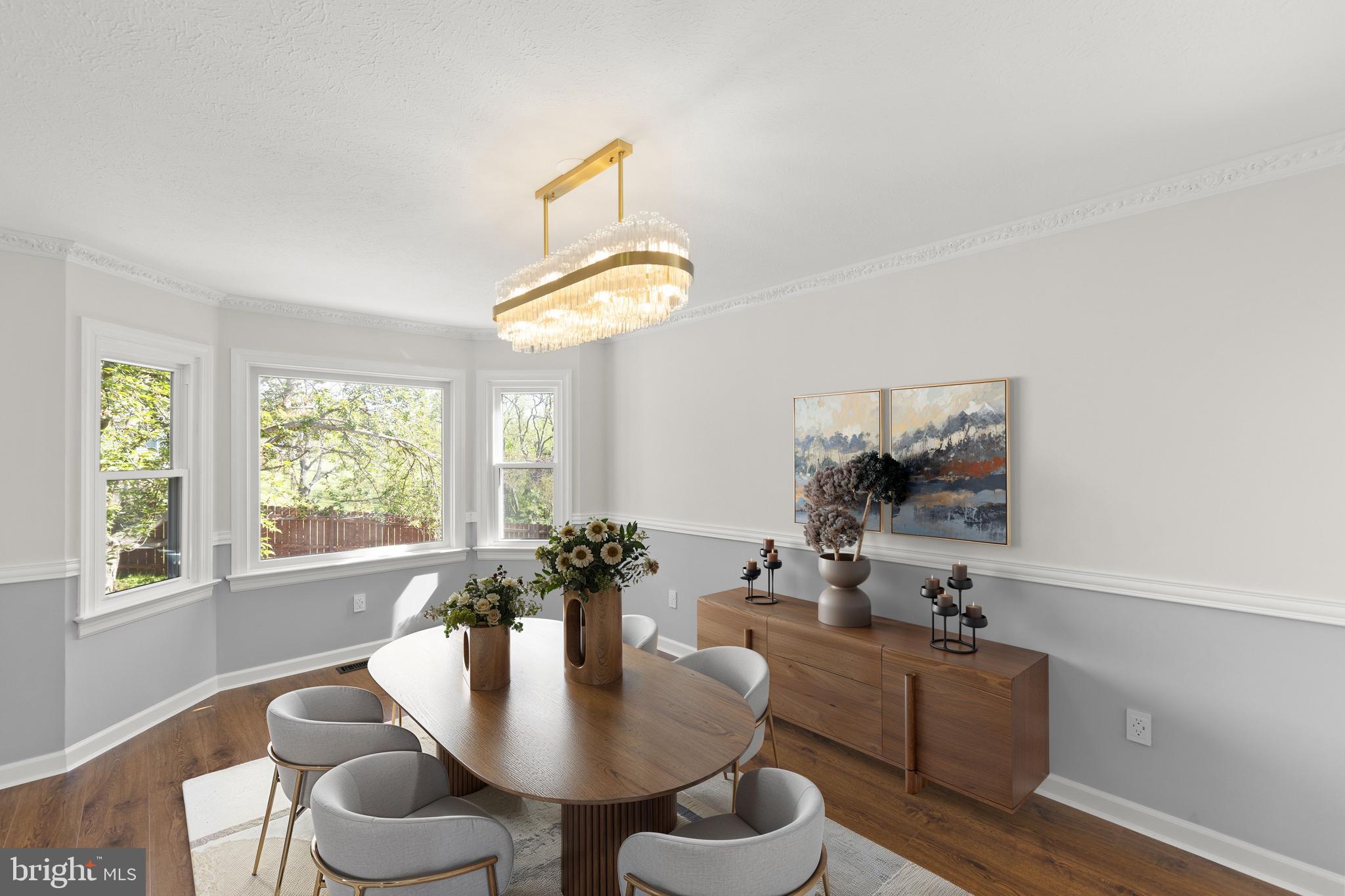 405 Spring Hollow Road Woodstock, VA 22664 - Photo 12 of 98 a living room with furniture a chandelier and a window