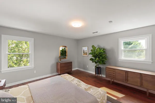 a kitchen with stainless steel appliances kitchen island a stove a sink and a refrigerator