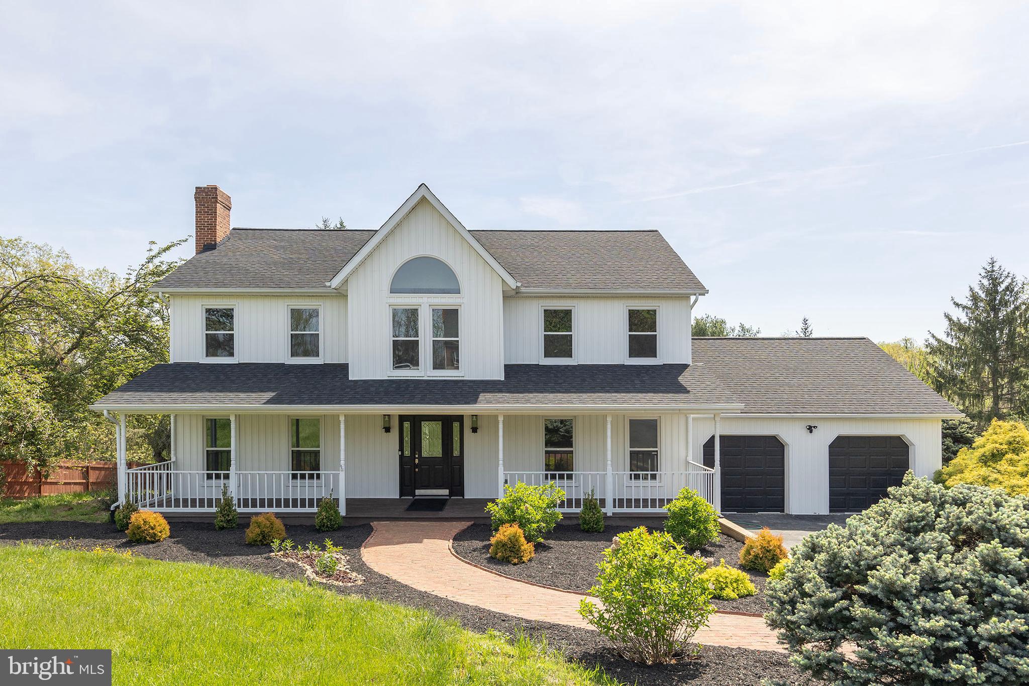 405 Spring Hollow Road Woodstock, VA 22664 - Photo 2 of 98 a front view of a house with swimming pool and porch