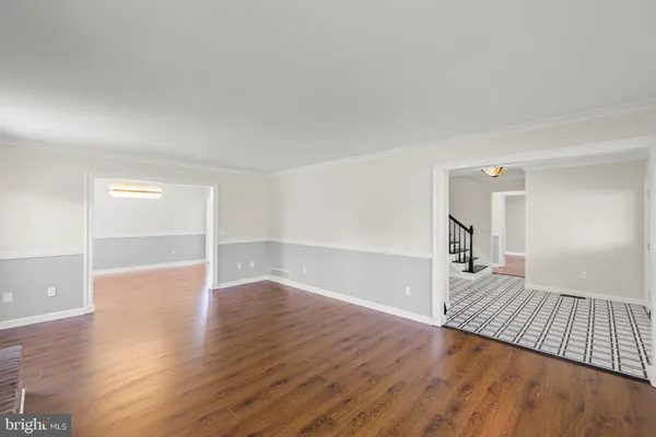 a view of an empty room with windows