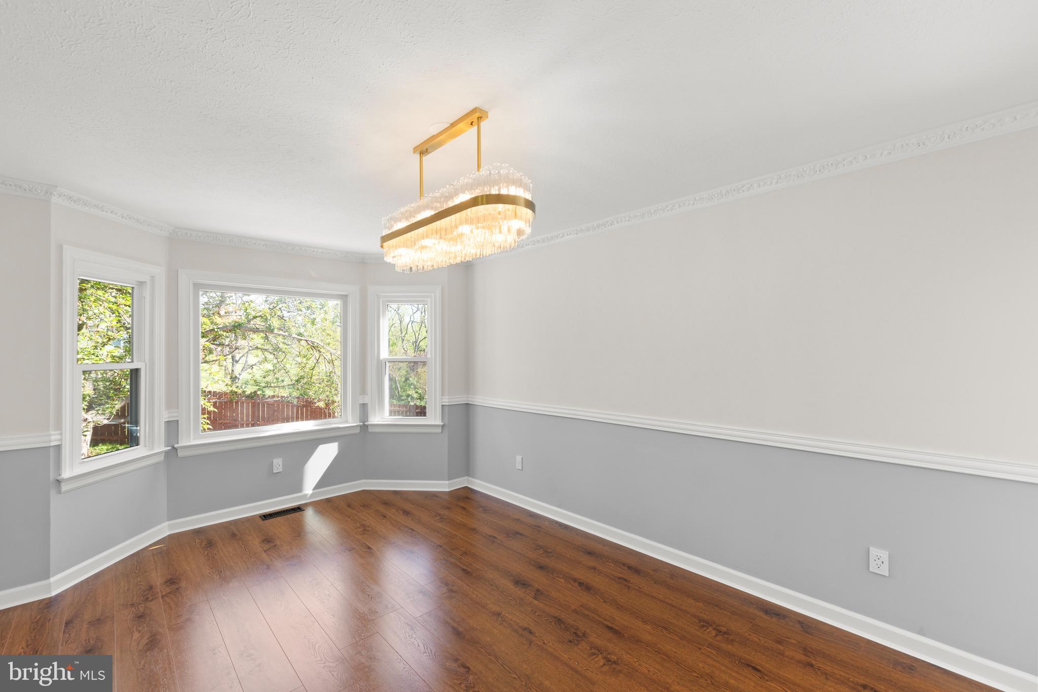 405 Spring Hollow Road Woodstock, VA 22664 - Photo 27 of 98 an empty room with wooden floor and windows