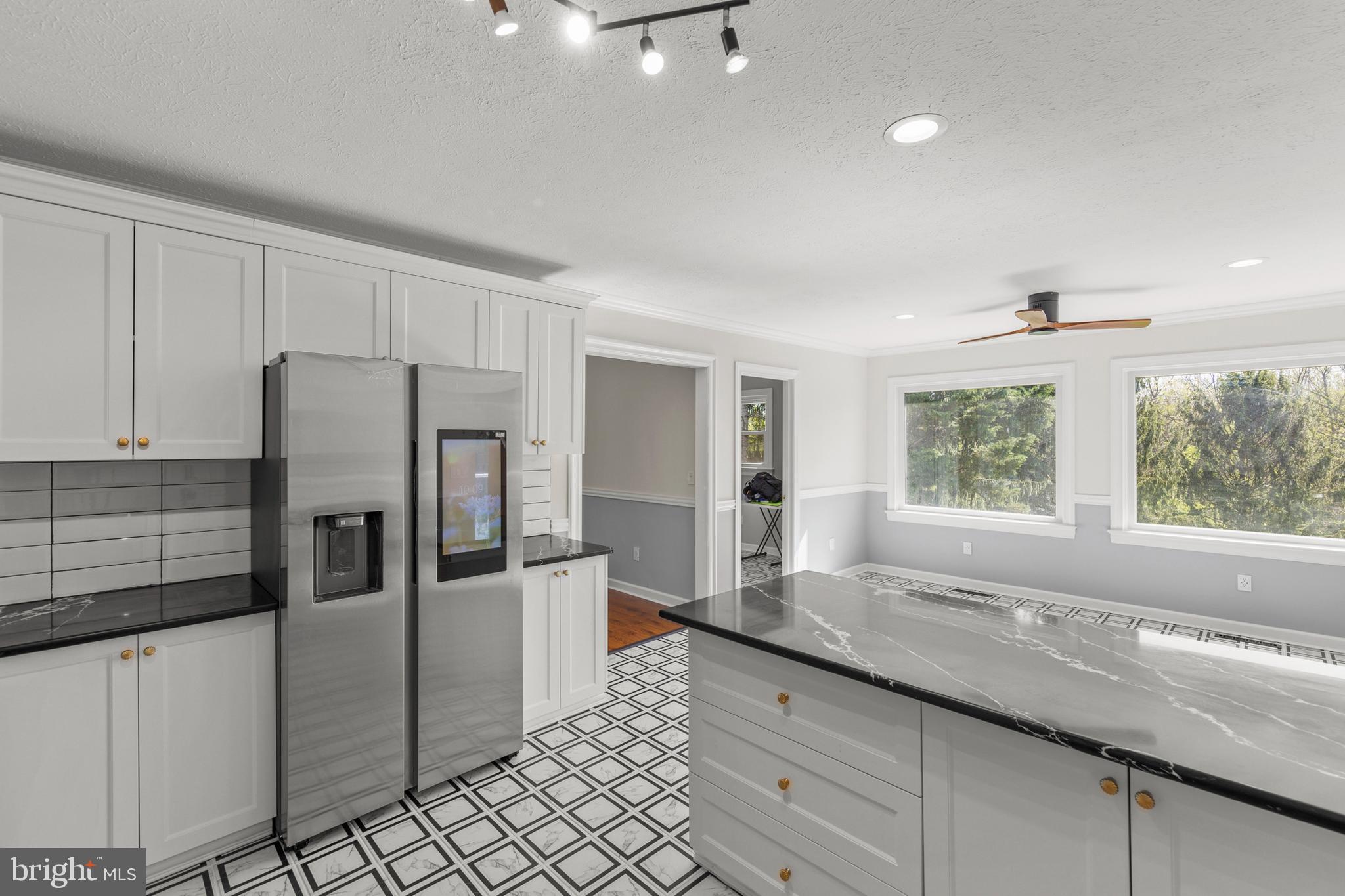 405 Spring Hollow Road Woodstock, VA 22664 - Photo 34 of 98 a kitchen with stainless steel appliances granite countertop a refrigerator and a sink