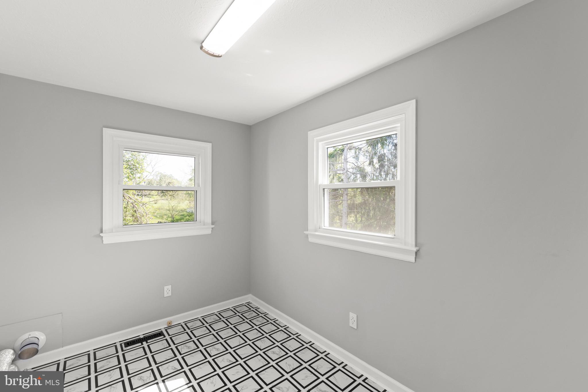 405 Spring Hollow Road Woodstock, VA 22664 - Photo 41 of 98 a view of an empty room with windows