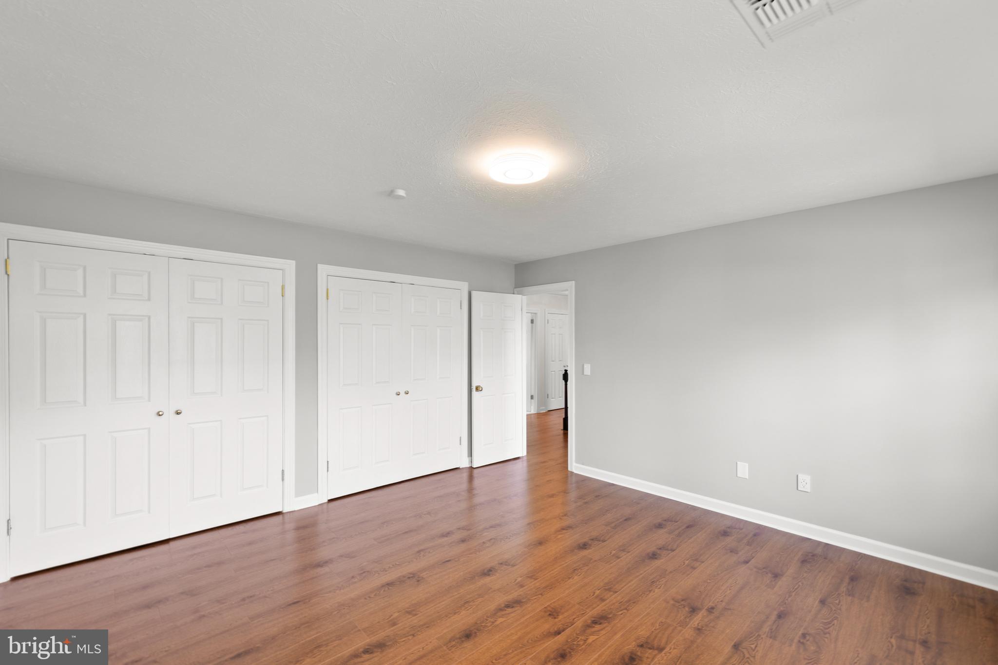 405 Spring Hollow Road Woodstock, VA 22664 - Photo 51 of 98 a big room with wooden floor and windows