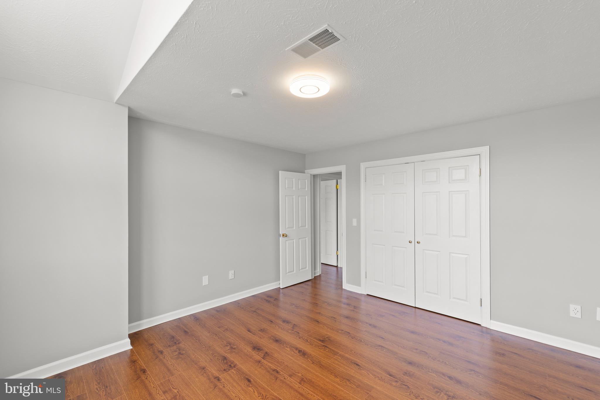 405 Spring Hollow Road Woodstock, VA 22664 - Photo 54 of 98 a view of an empty room with wooden floor