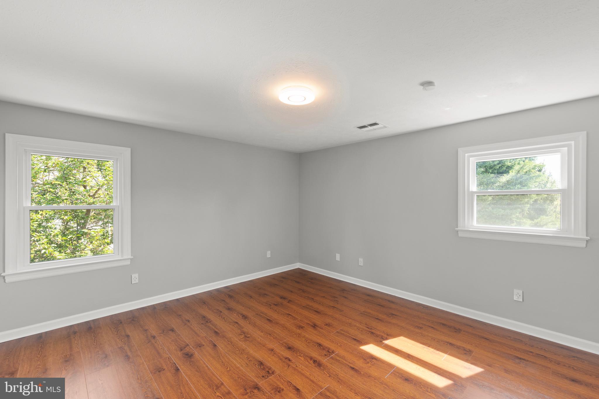 405 Spring Hollow Road Woodstock, VA 22664 - Photo 55 of 98 wooden floor in an empty room with a window