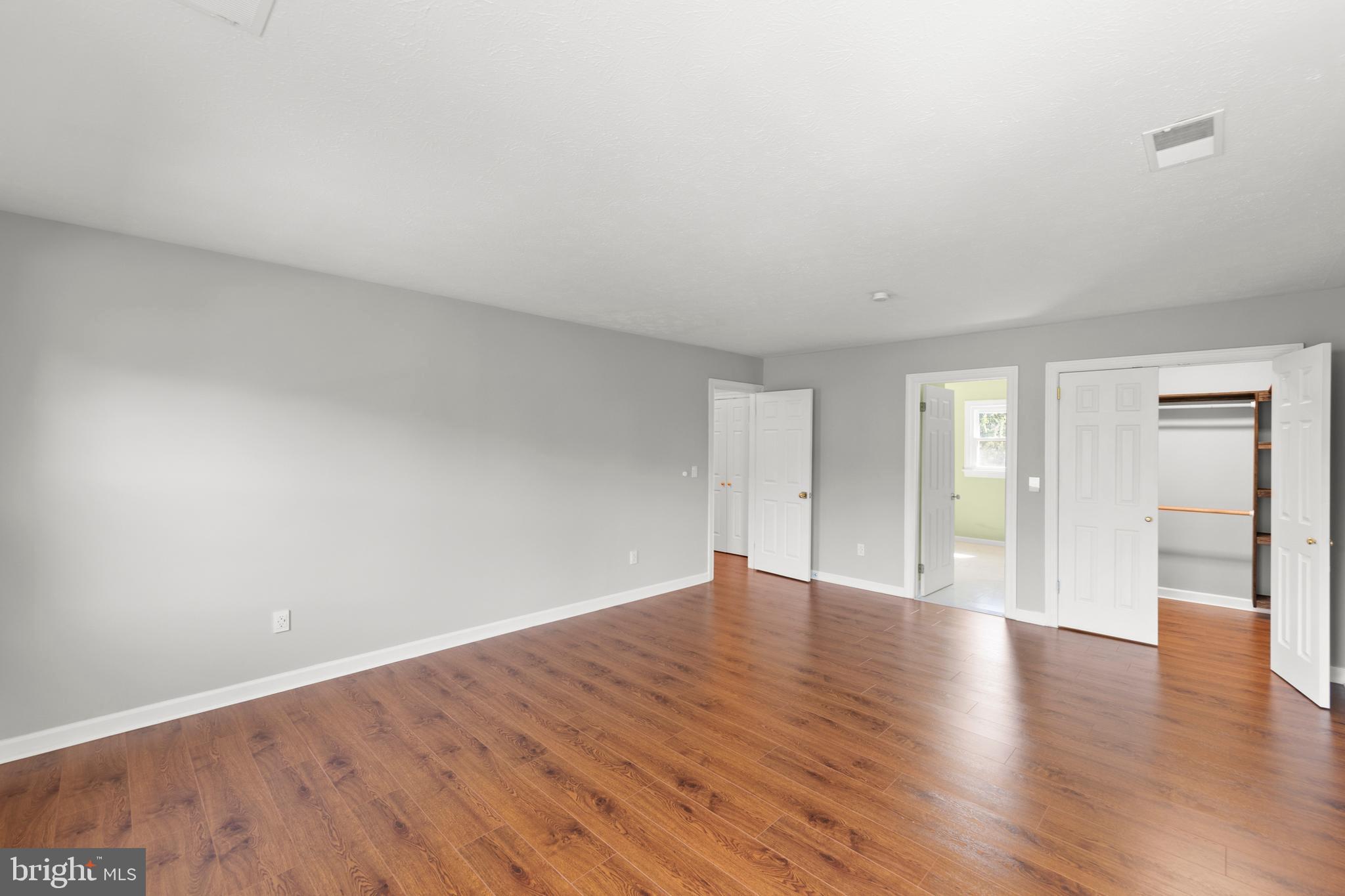 405 Spring Hollow Road Woodstock, VA 22664 - Photo 63 of 98 a view of an empty room with wooden floor and a window
