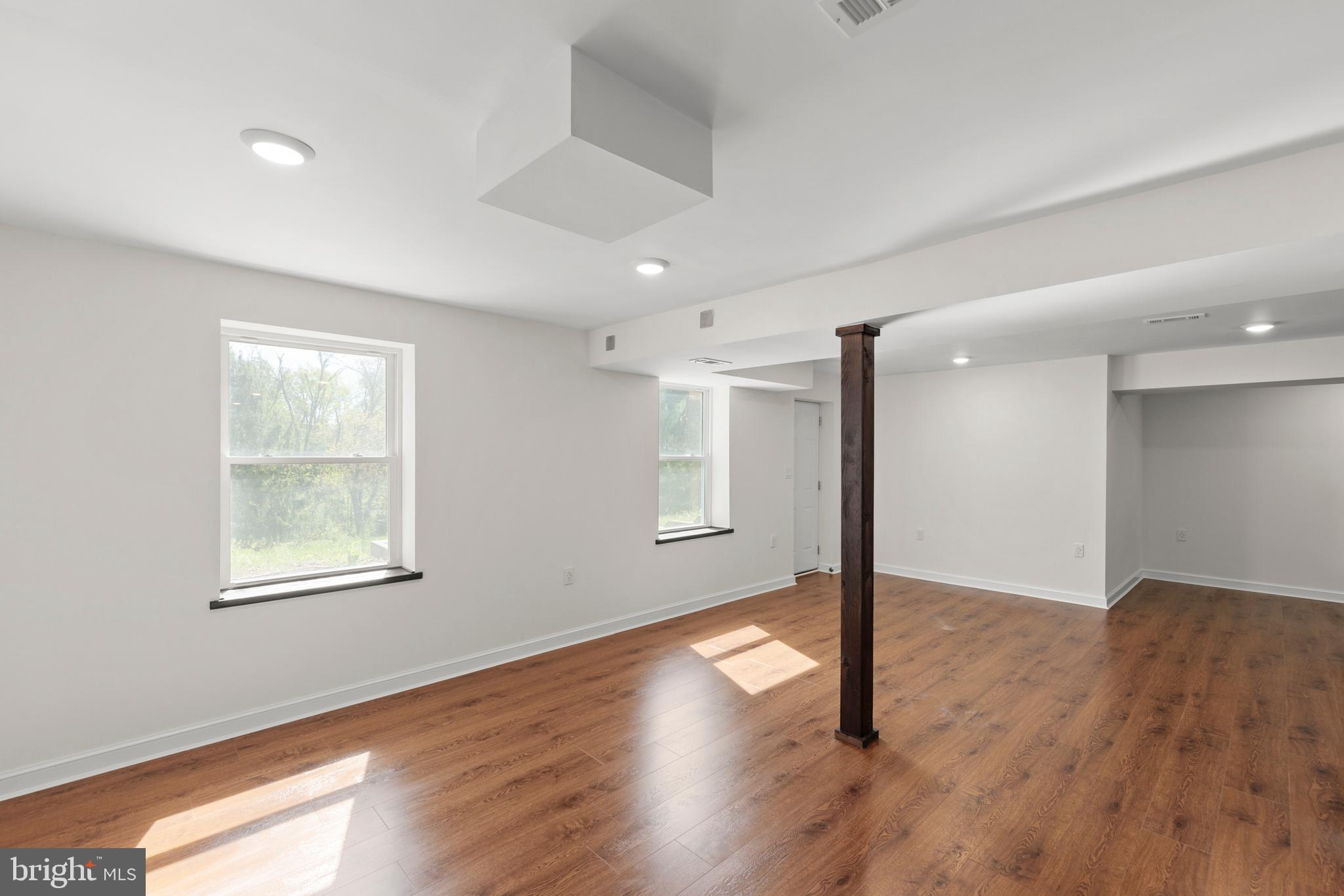 405 Spring Hollow Road Woodstock, VA 22664 - Photo 71 of 98 a view of an empty room with wooden floor and a window