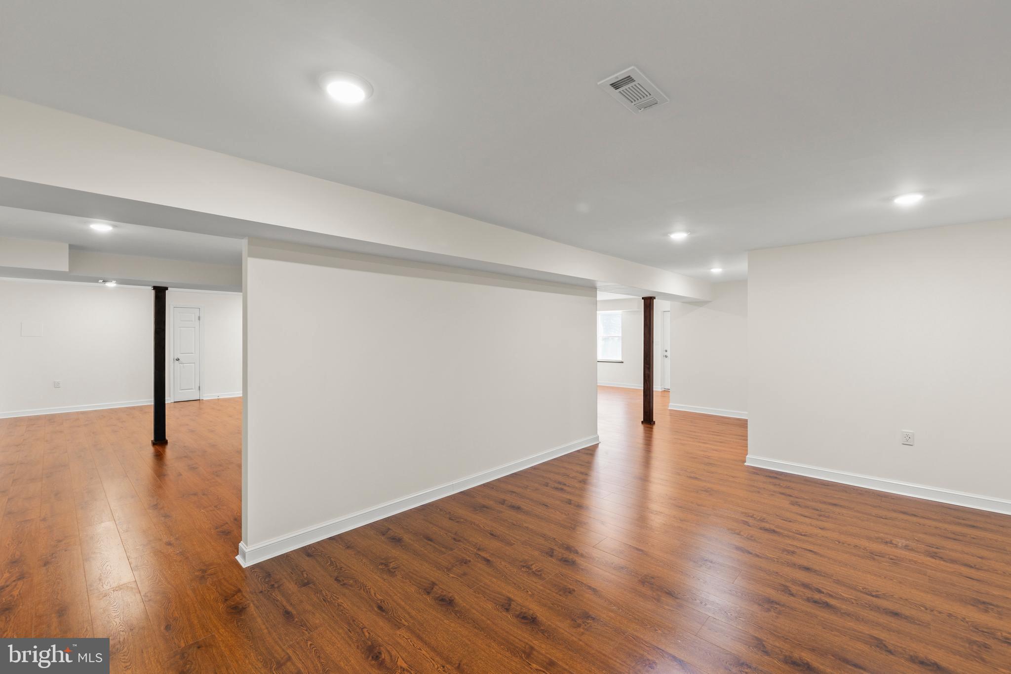 405 Spring Hollow Road Woodstock, VA 22664 - Photo 75 of 98 a view of an empty room with wooden floor