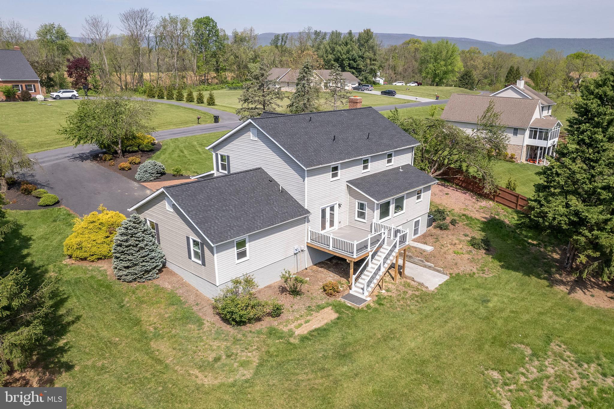 405 Spring Hollow Road Woodstock, VA 22664 - Photo 94 of 98 an aerial view of a house with a garden and large trees