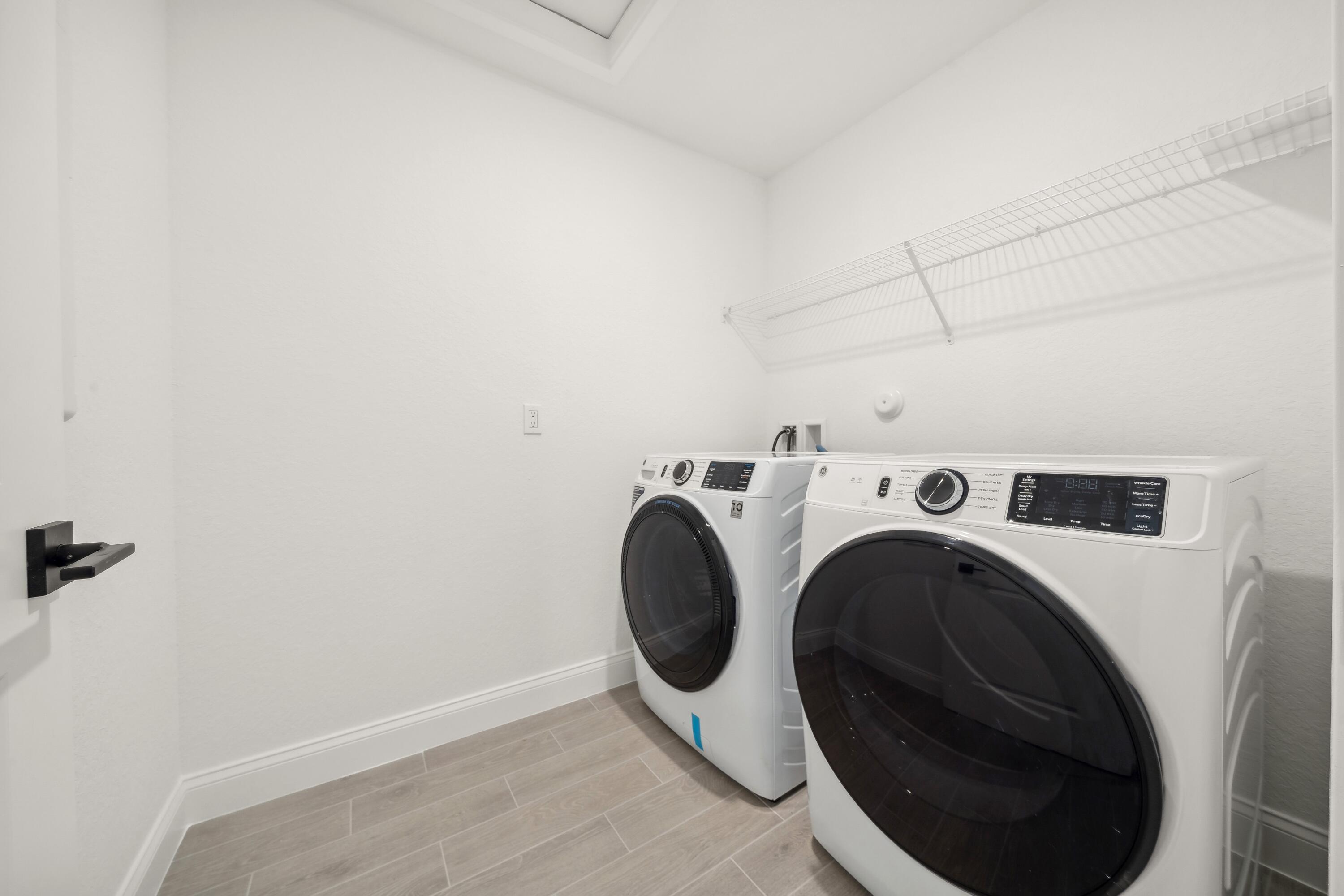 171 Southeast Birch Terrace, Unit 740 Stuart, FL 34997 - Photo 21 of 30 a utility room with dryer and washer