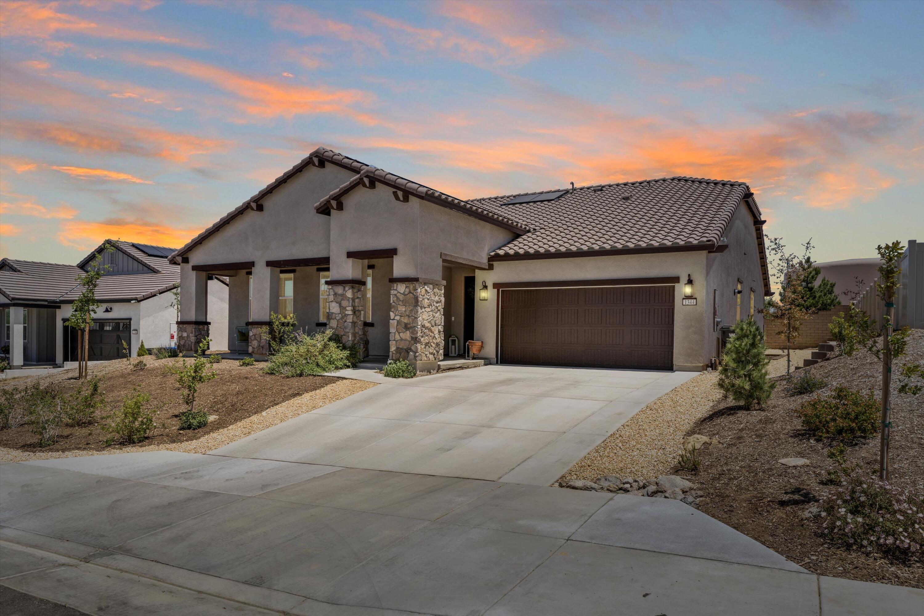1344 Bodega Drive Tehachapi, CA 93561 - Photo 1 of 34 a front view of a house with a yard and garage