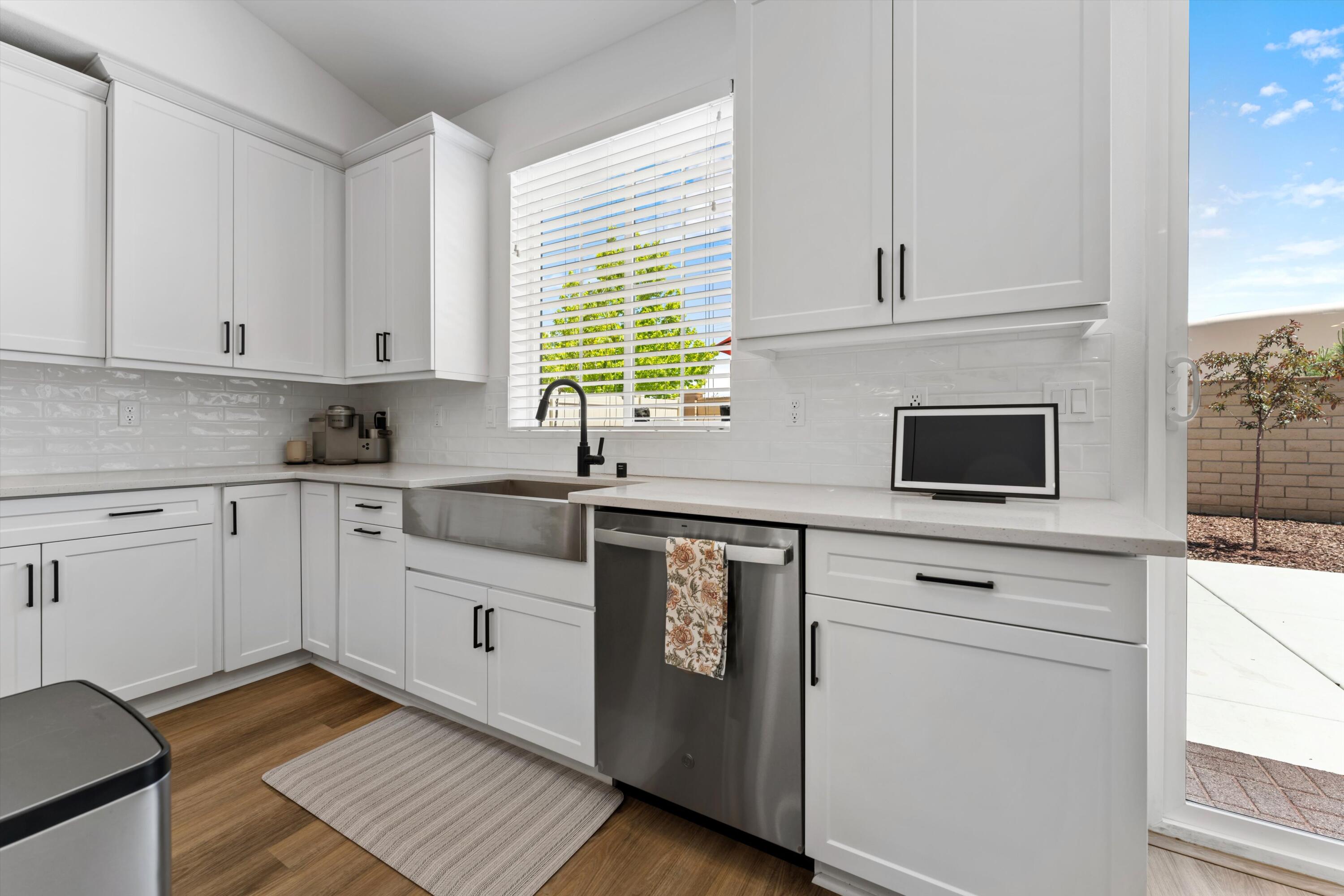 1344 Bodega Drive Tehachapi, CA 93561 - Photo 17 of 34 a kitchen with stainless steel appliances white cabinets and a sink