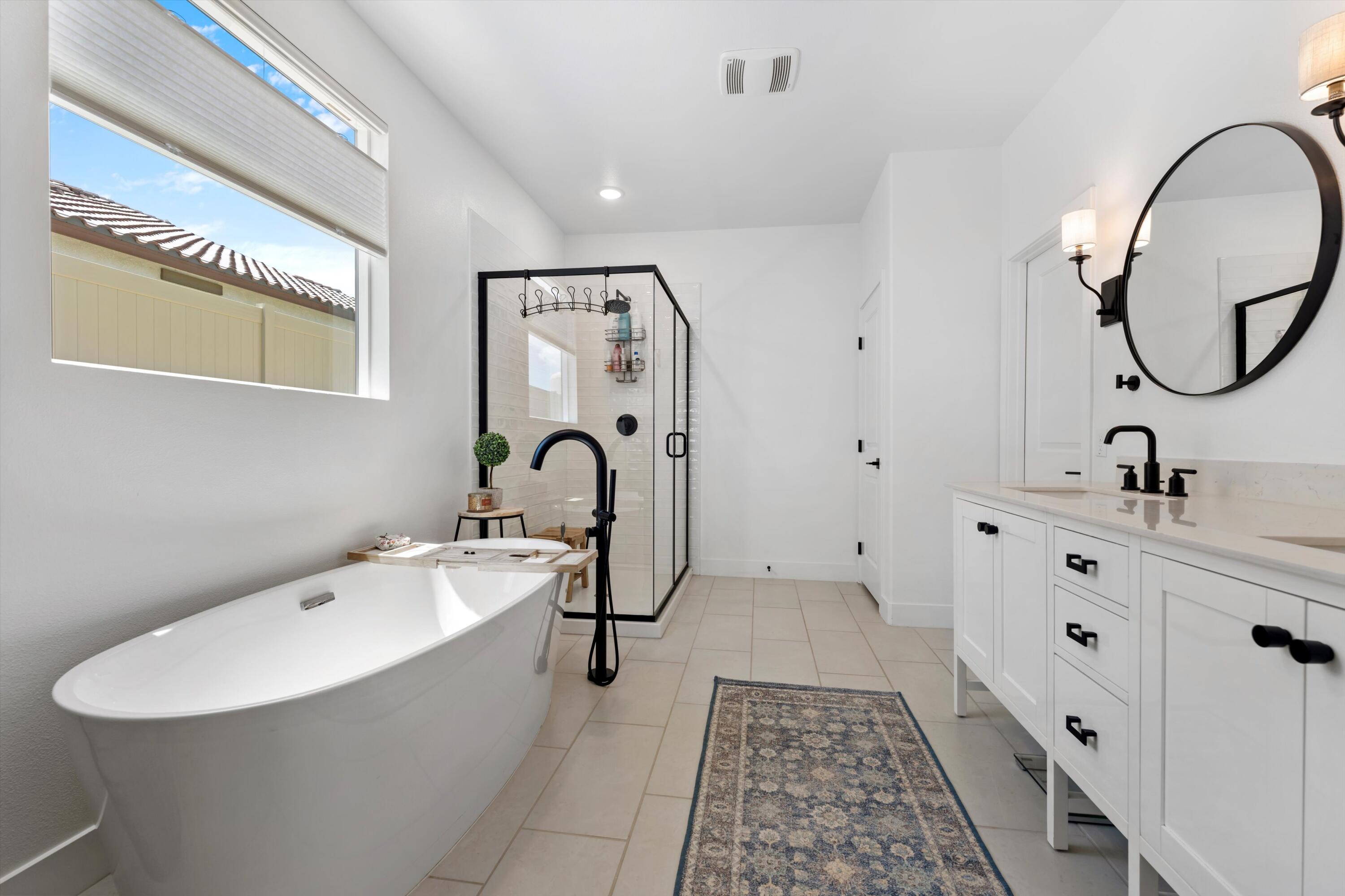 1344 Bodega Drive Tehachapi, CA 93561 - Photo 23 of 34 a spacious bathroom with a double vanity sink mirror and bathtub