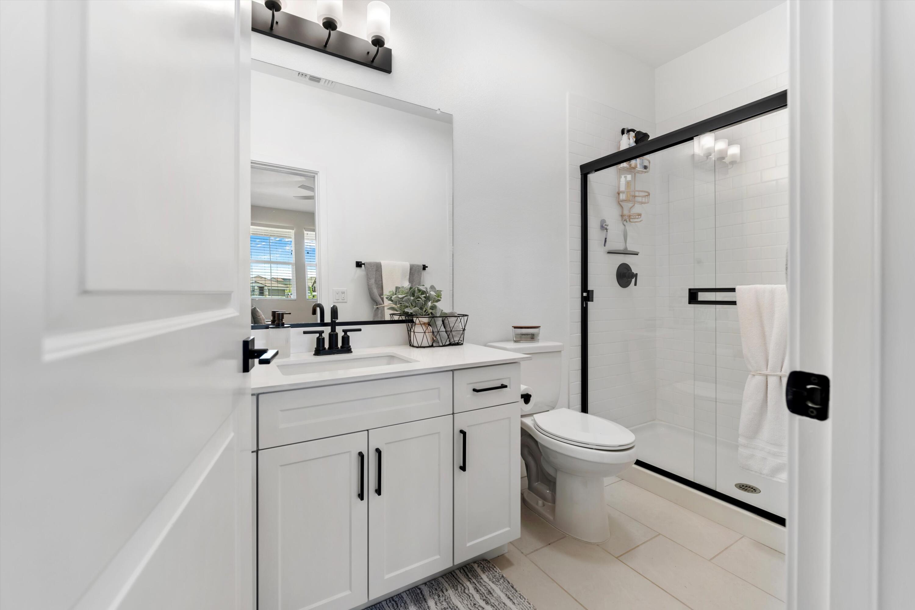 1344 Bodega Drive Tehachapi, CA 93561 - Photo 25 of 34 a bathroom with a sink toilet and shower