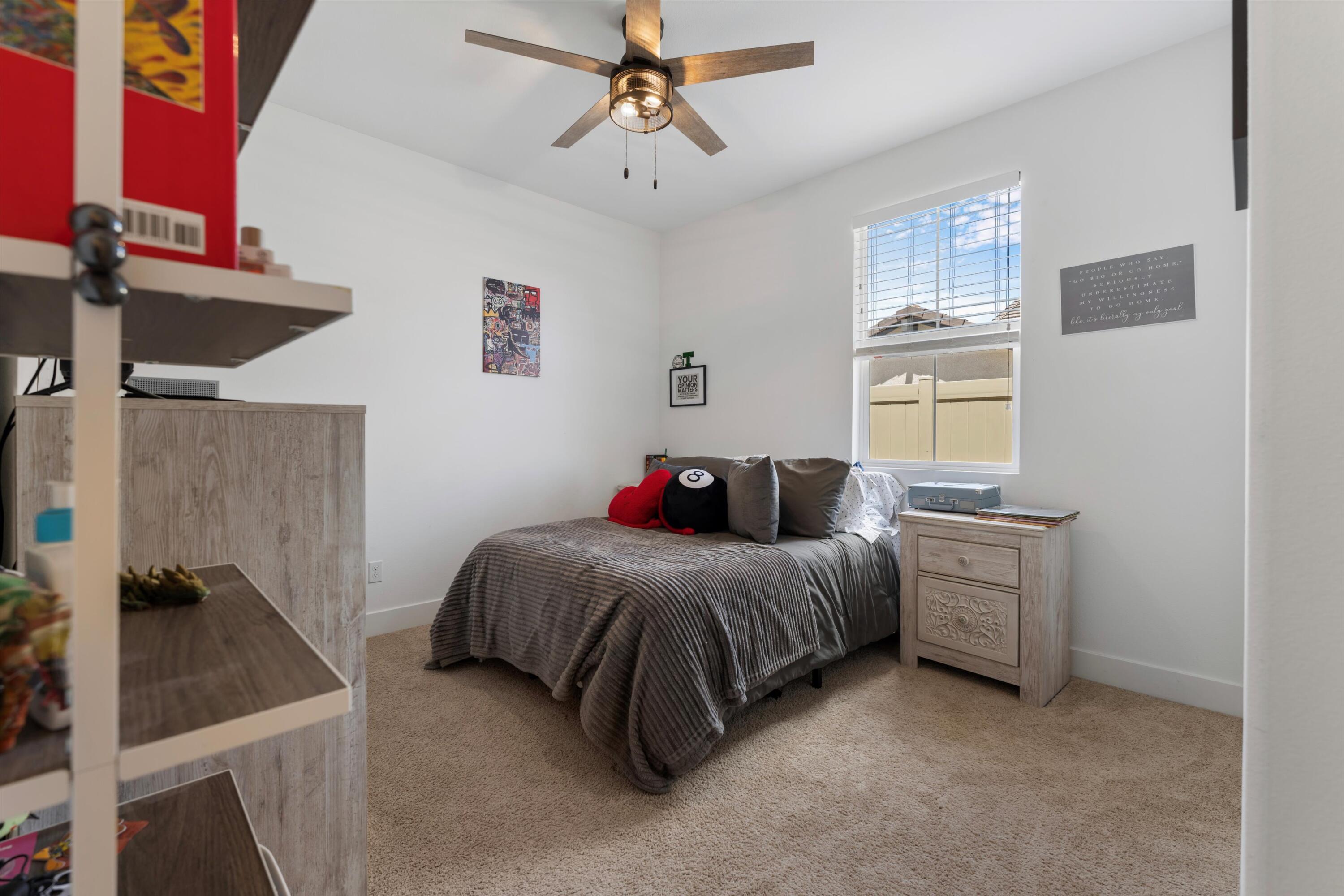 1344 Bodega Drive Tehachapi, CA 93561 - Photo 26 of 34 a bedroom with a bed and a window