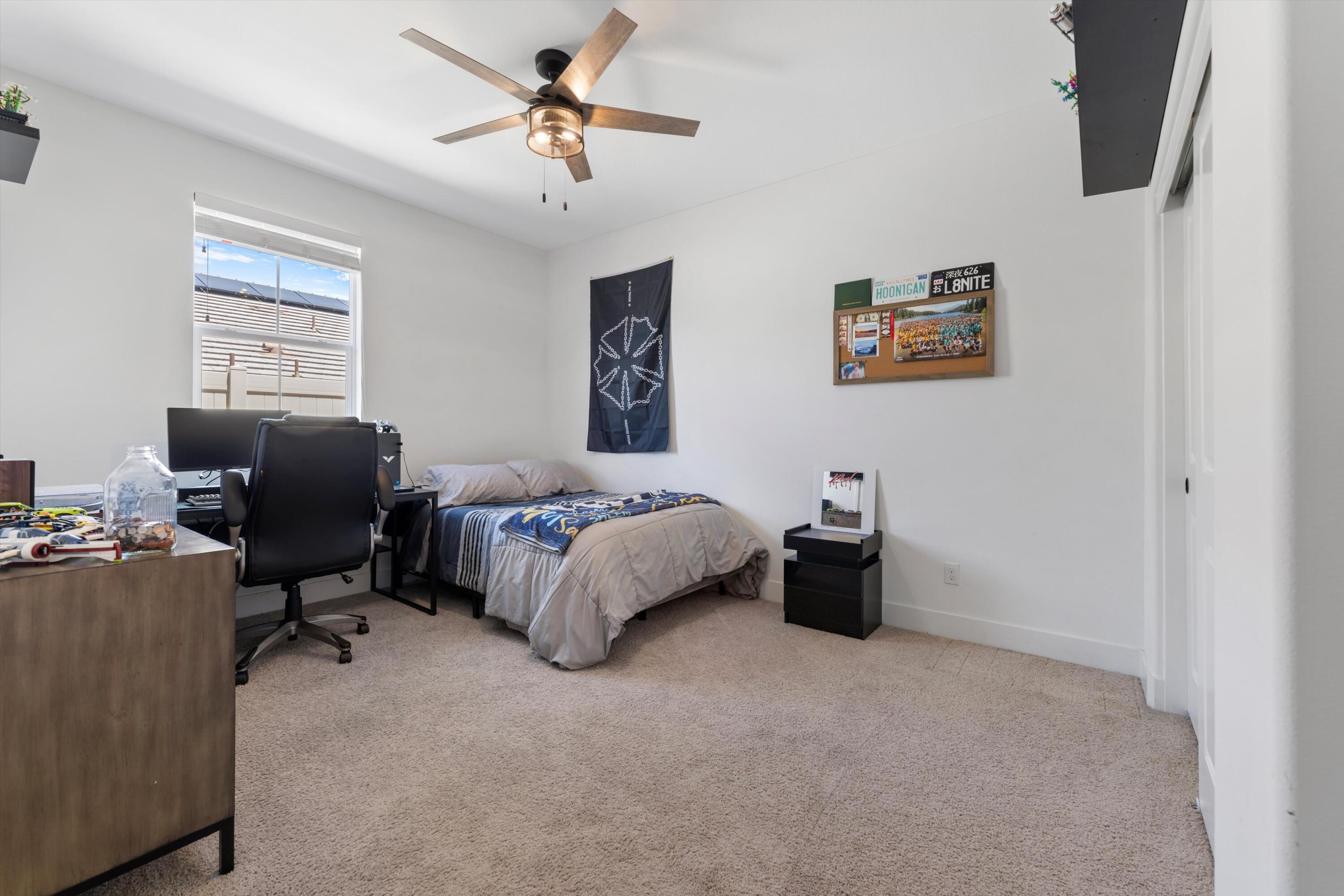 1344 Bodega Drive Tehachapi, CA 93561 - Photo 30 of 34 a bedroom with a bed and a couch