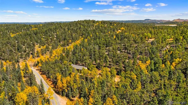 a view of mountain with sunset