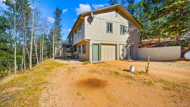 a balcony view with a yard