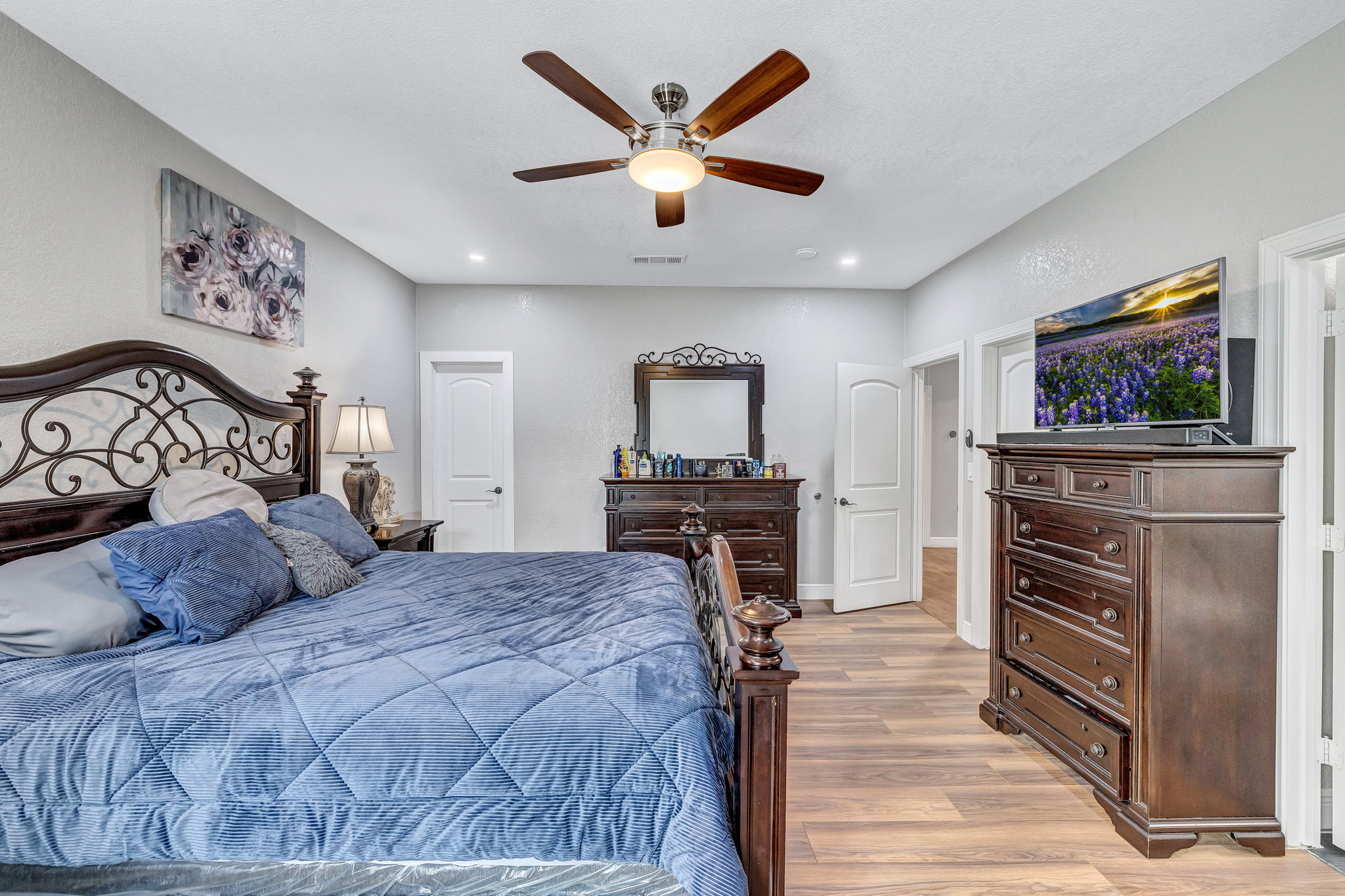 421 Las Lomas Drive Elgin, TX 78621 - Photo 11 of 30 Bedroom with light wood-type flooring, a ceiling fan, and recessed lighting