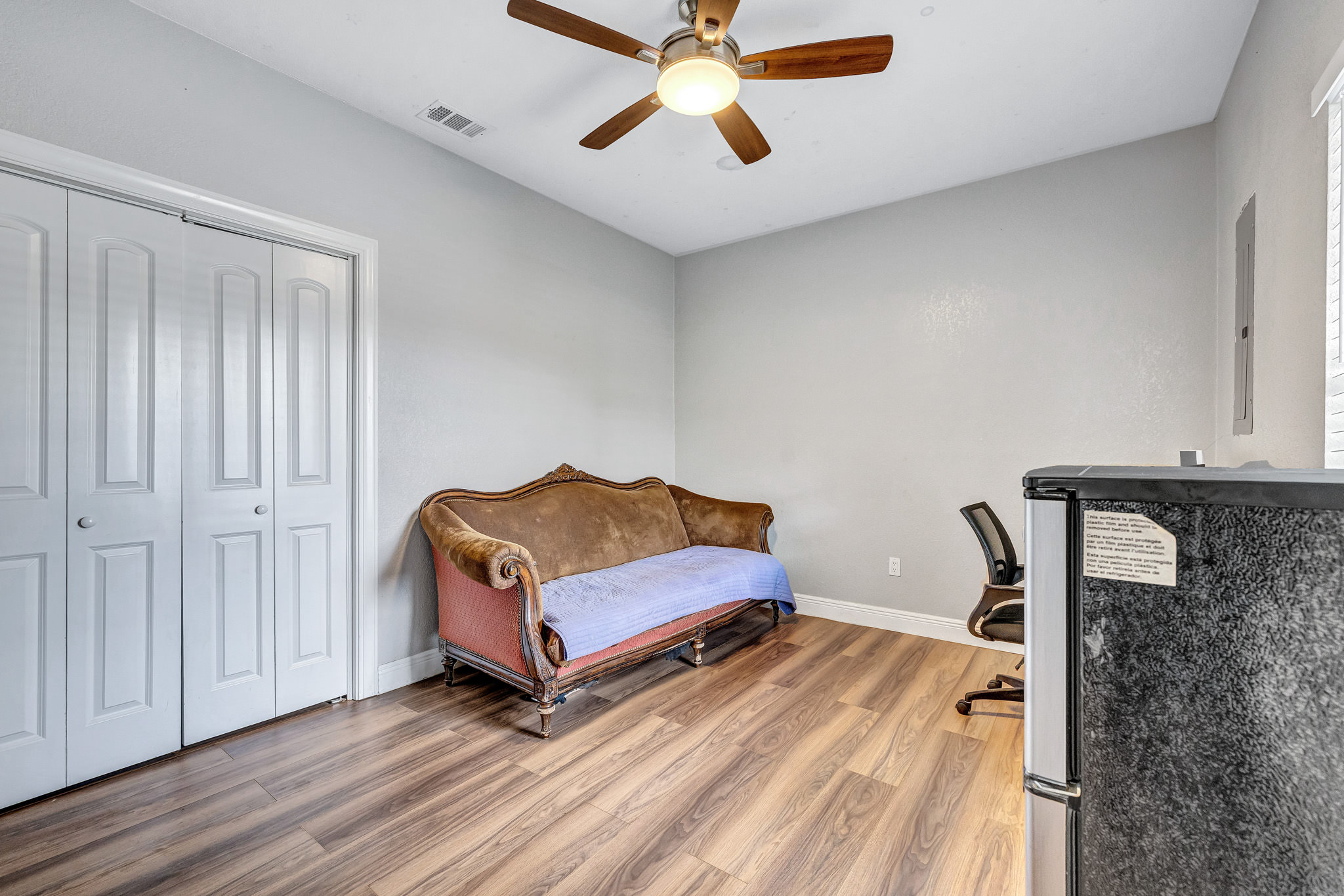 421 Las Lomas Drive Elgin, TX 78621 - Photo 21 of 30 Bedroom featuring light wood-type flooring, ceiling fan, and a closet