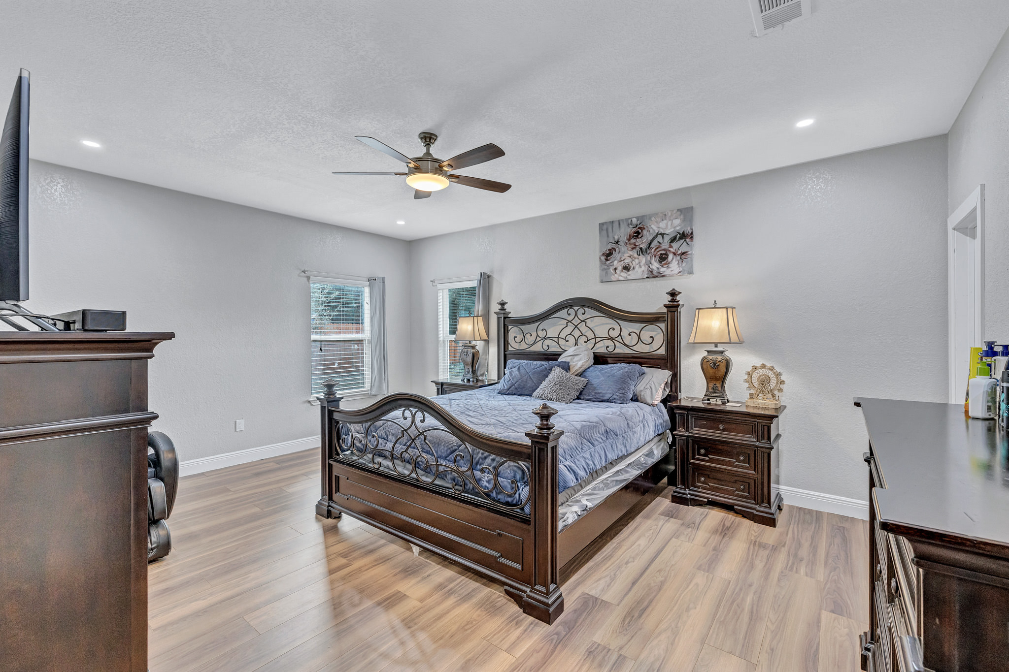 421 Las Lomas Drive Elgin, TX 78621 - Photo 8 of 30 Bedroom with light wood finished floors, ceiling fan, and recessed lighting