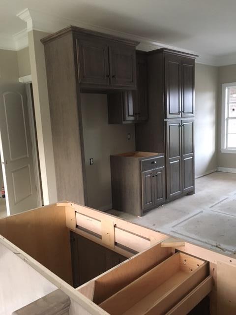 31 Sheltontown Road Manchester, TN 37355 - Photo 8 of 16 a kitchen with stainless steel appliances wooden cabinets and a refrigerator