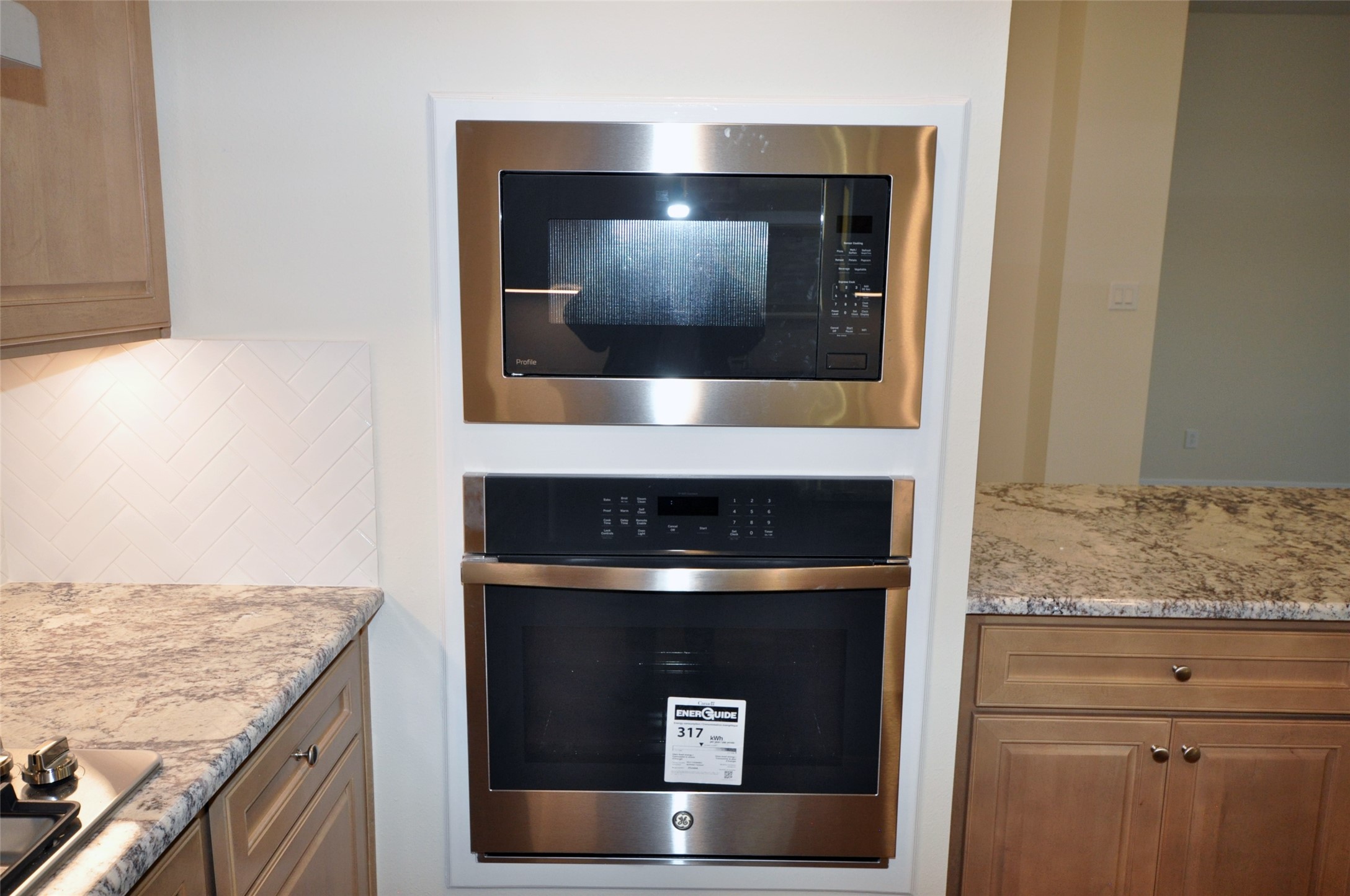 3701 Pedregal Road League City, TX 77573 - Photo 14 of 48 a kitchen with a stove and a microwave