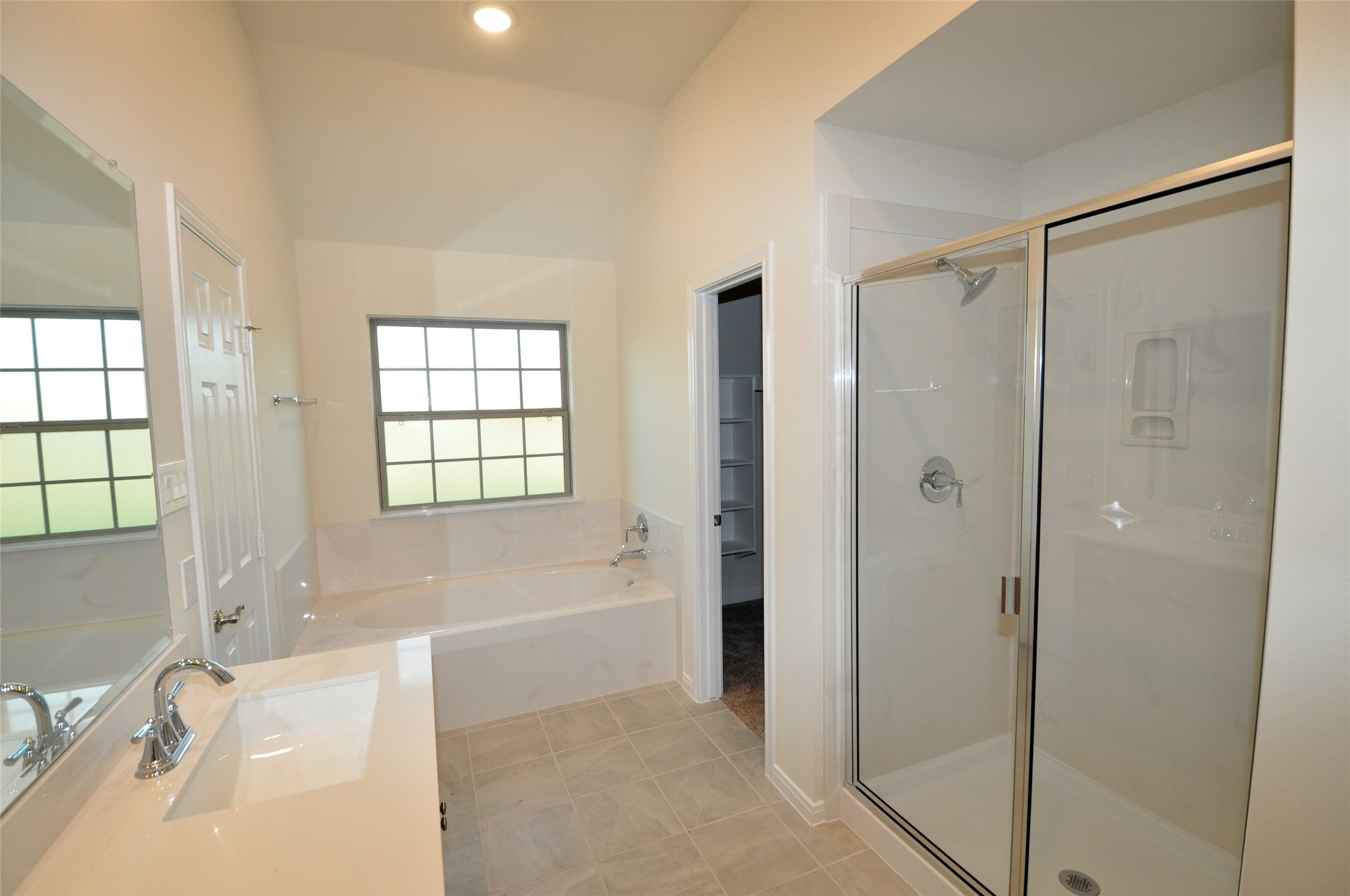 3701 Pedregal Road League City, TX 77573 - Photo 22 of 48 a bathroom with a bathtub shower and a sink
