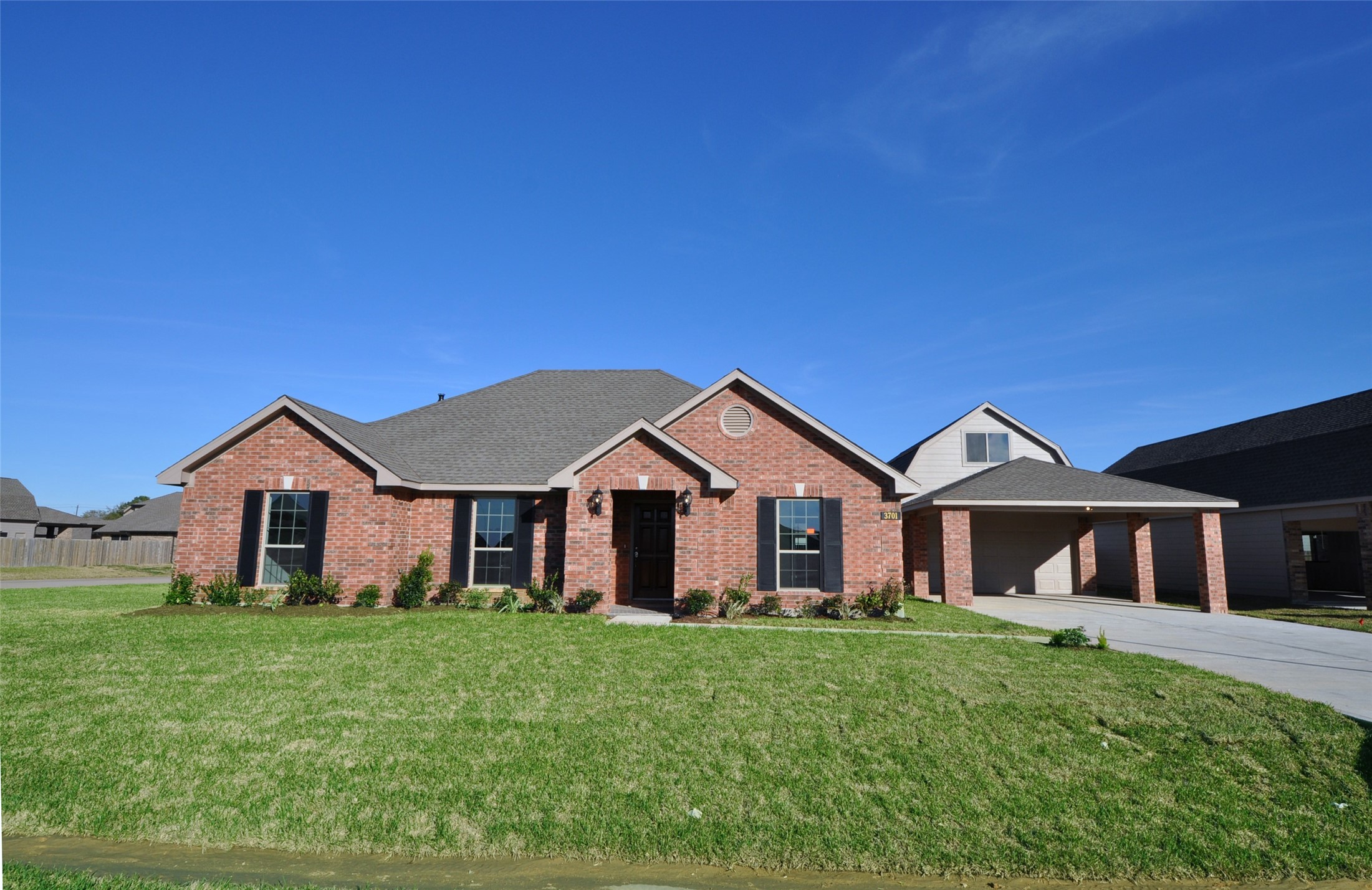3701 Pedregal Road League City, TX 77573 - Photo 3 of 48 a front view of a house with a yard