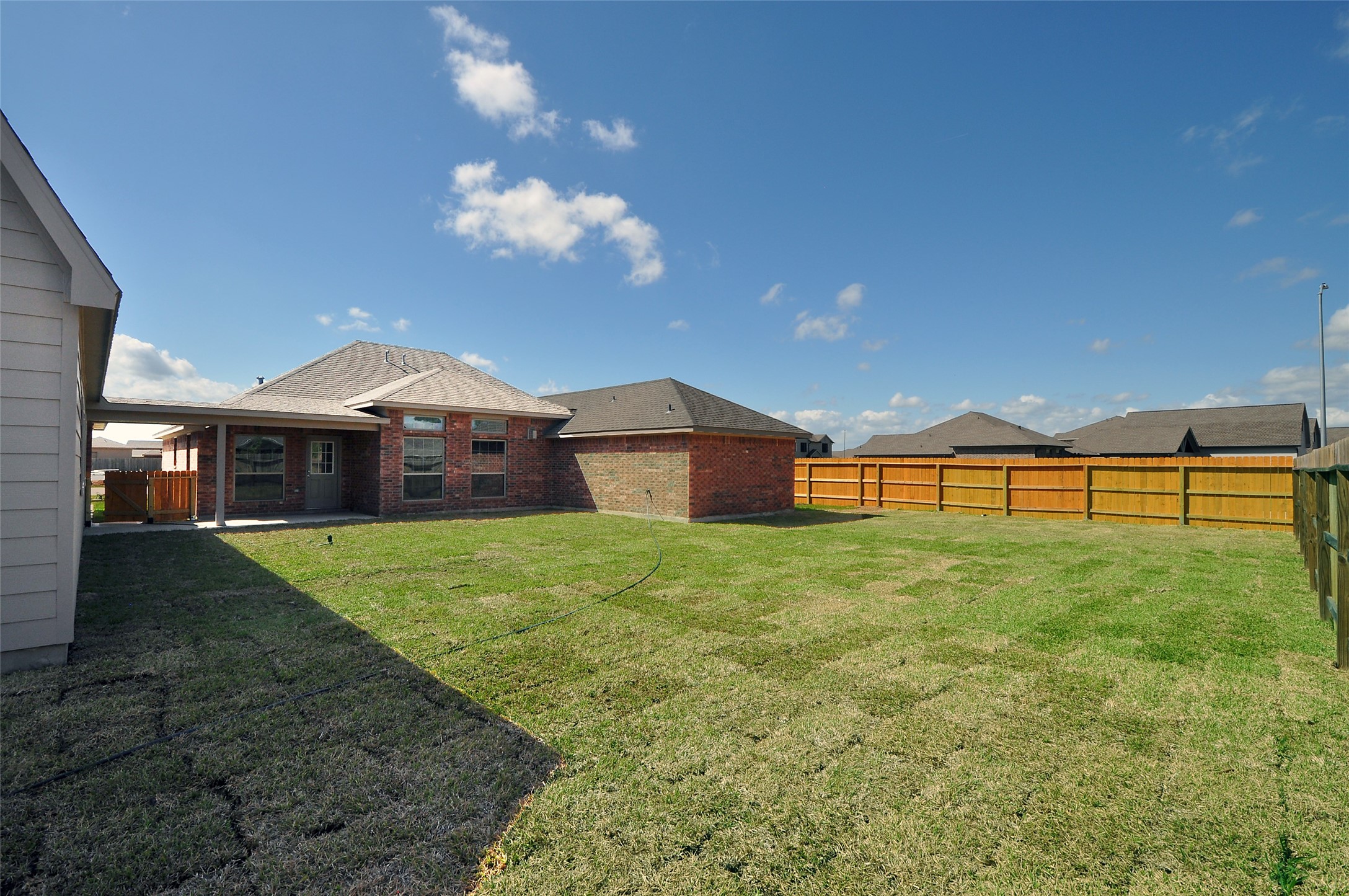 3701 Pedregal Road League City, TX 77573 - Photo 43 of 48 a front view of a house with a yard and garage