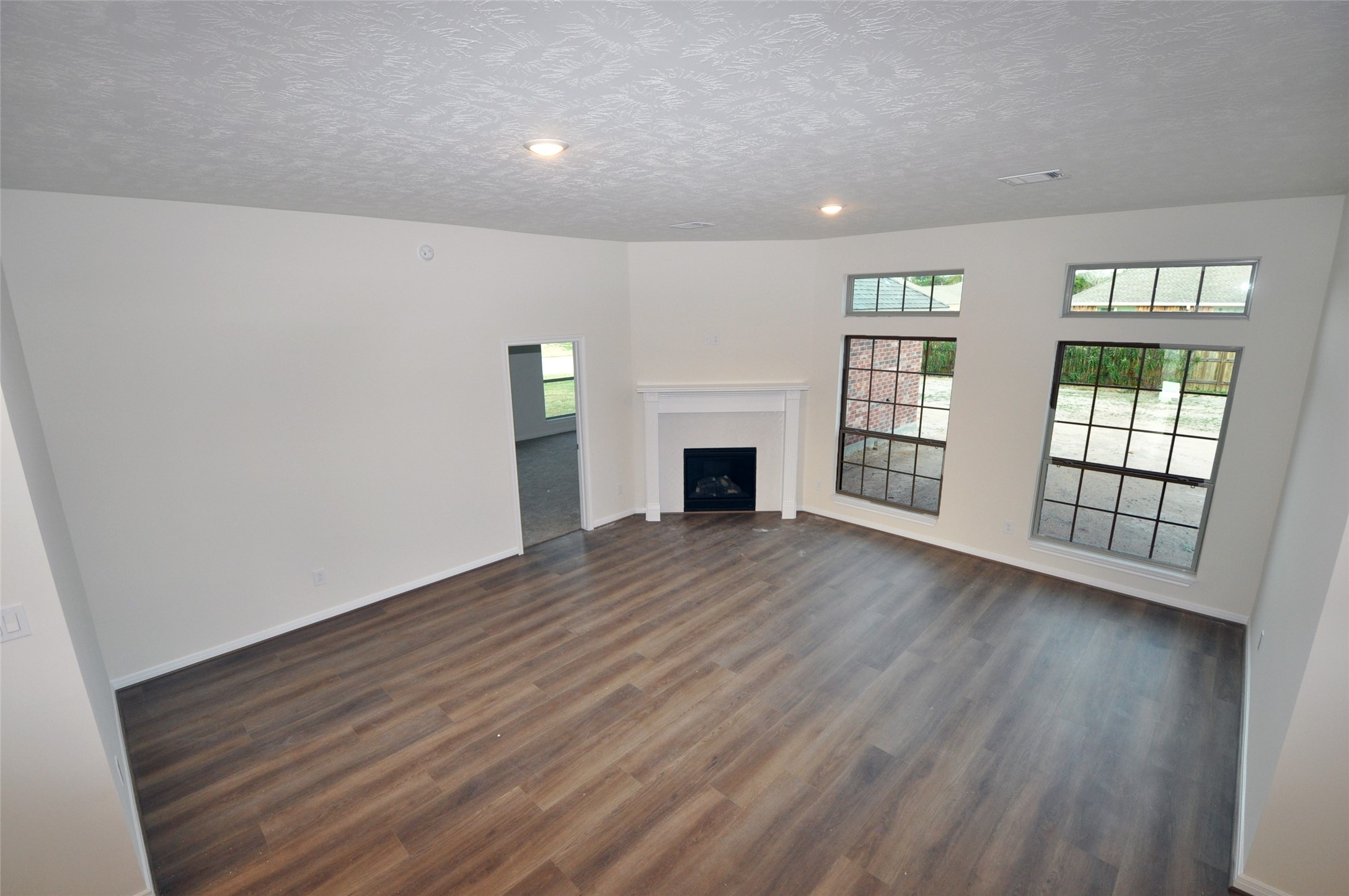 3701 Pedregal Road League City, TX 77573 - Photo 9 of 48 wooden floor in an empty room with a window