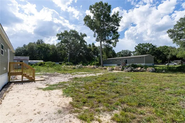 a view of a garden with a bench