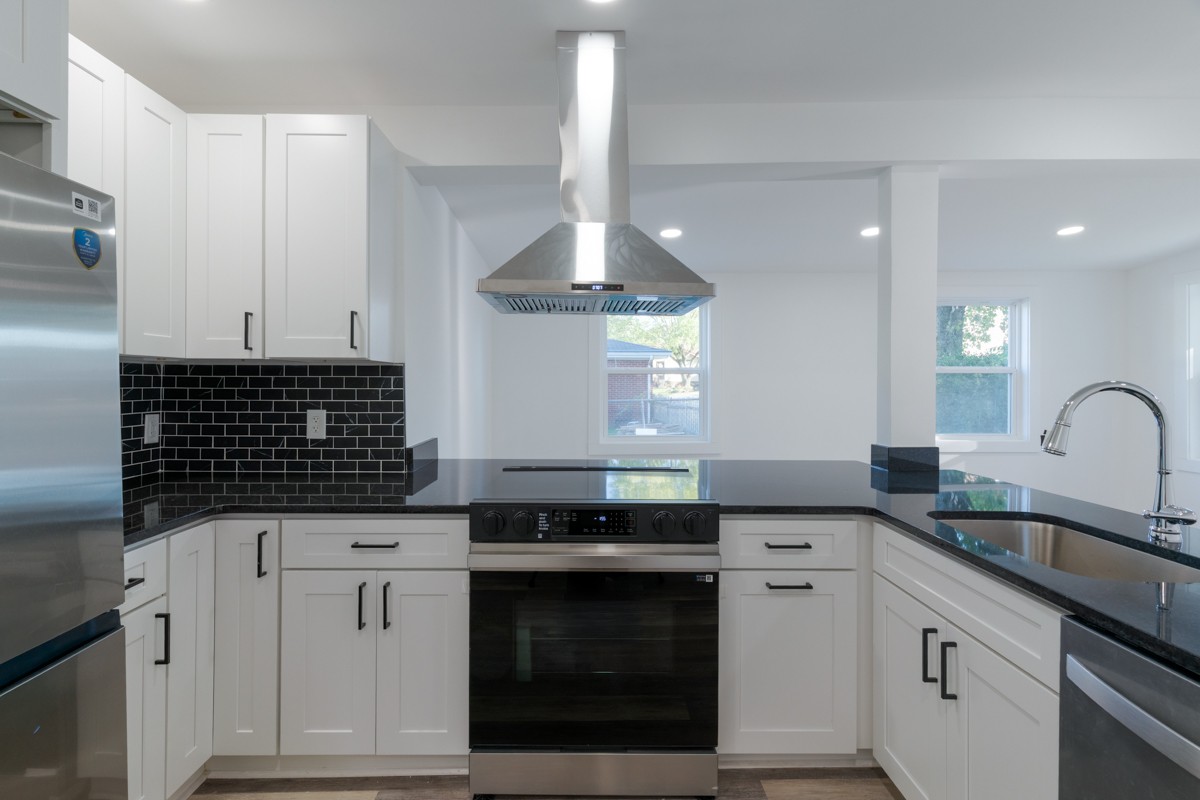 342 Crescent Drive Springfield, TN 37172 - Photo 11 of 31 a kitchen with granite countertop a sink stainless steel appliances and cabinets