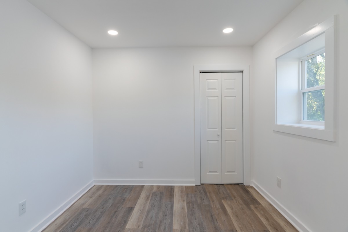 342 Crescent Drive Springfield, TN 37172 - Photo 17 of 31 wooden floor in an empty room with a window