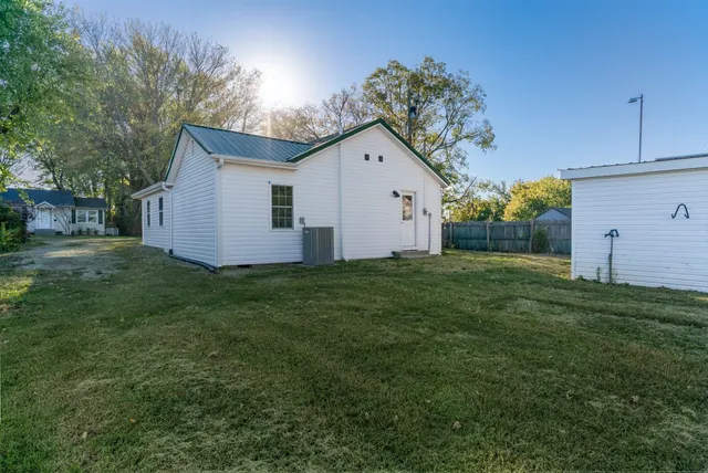 a backyard of a house with lots of green space