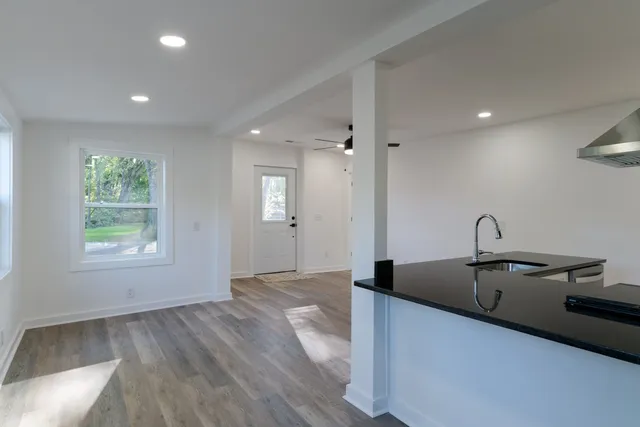 a very nice looking room with wooden floor