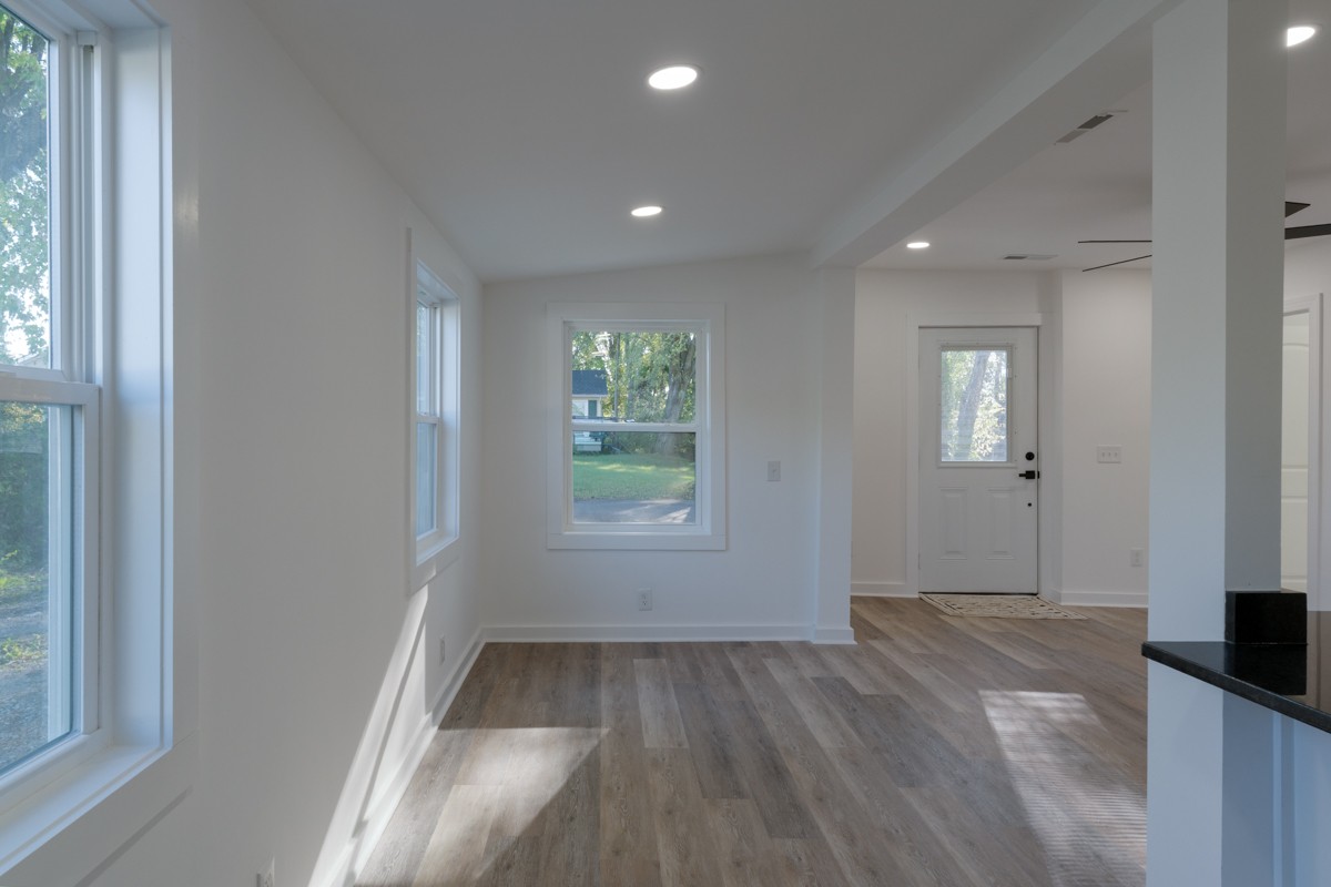 342 Crescent Drive Springfield, TN 37172 - Photo 8 of 31 an empty room with wooden floor and windows