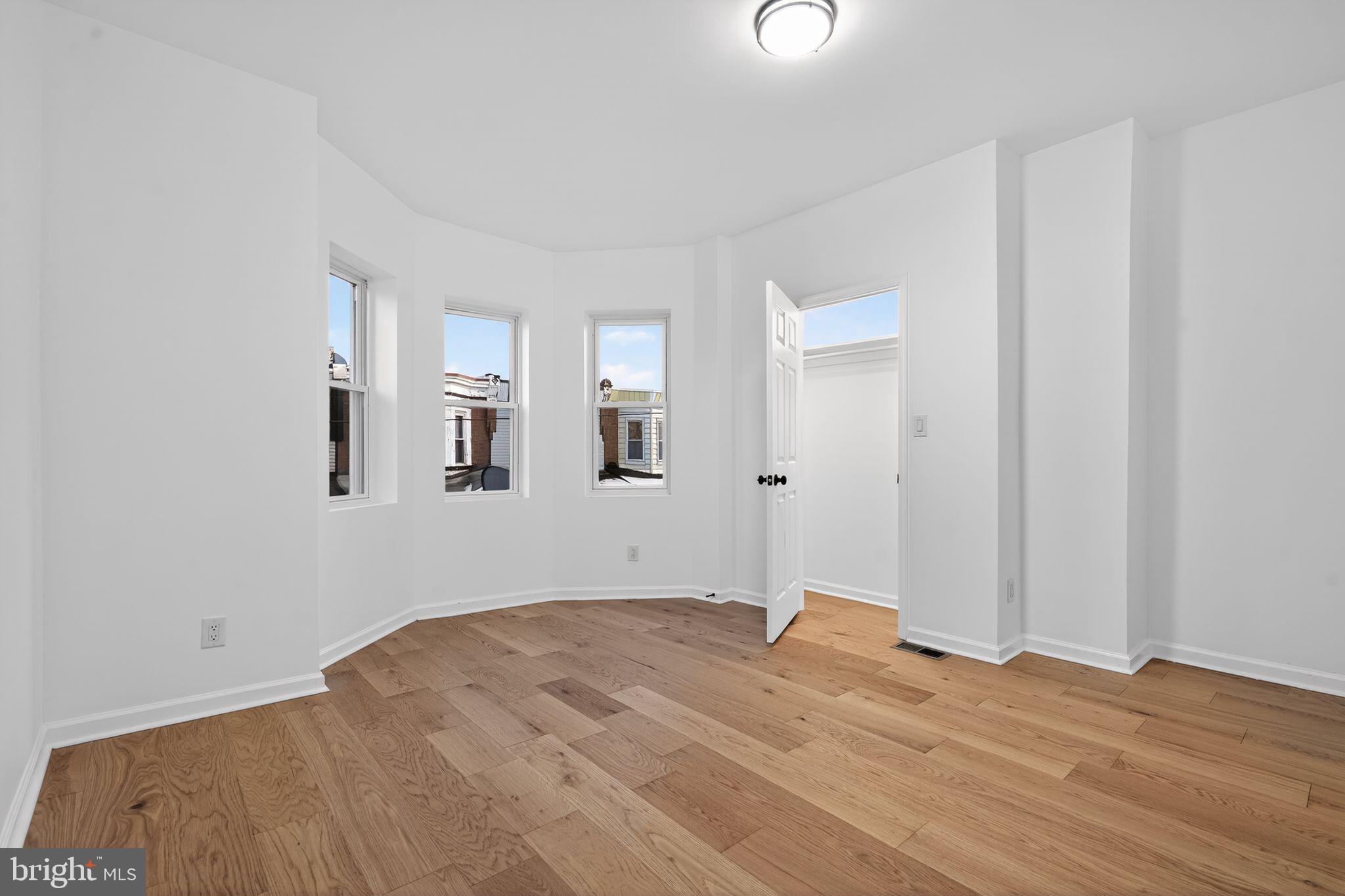 5311 Upland Street Philadelphia, PA 19143 - Photo 16 of 31 a view of empty room with wooden floor