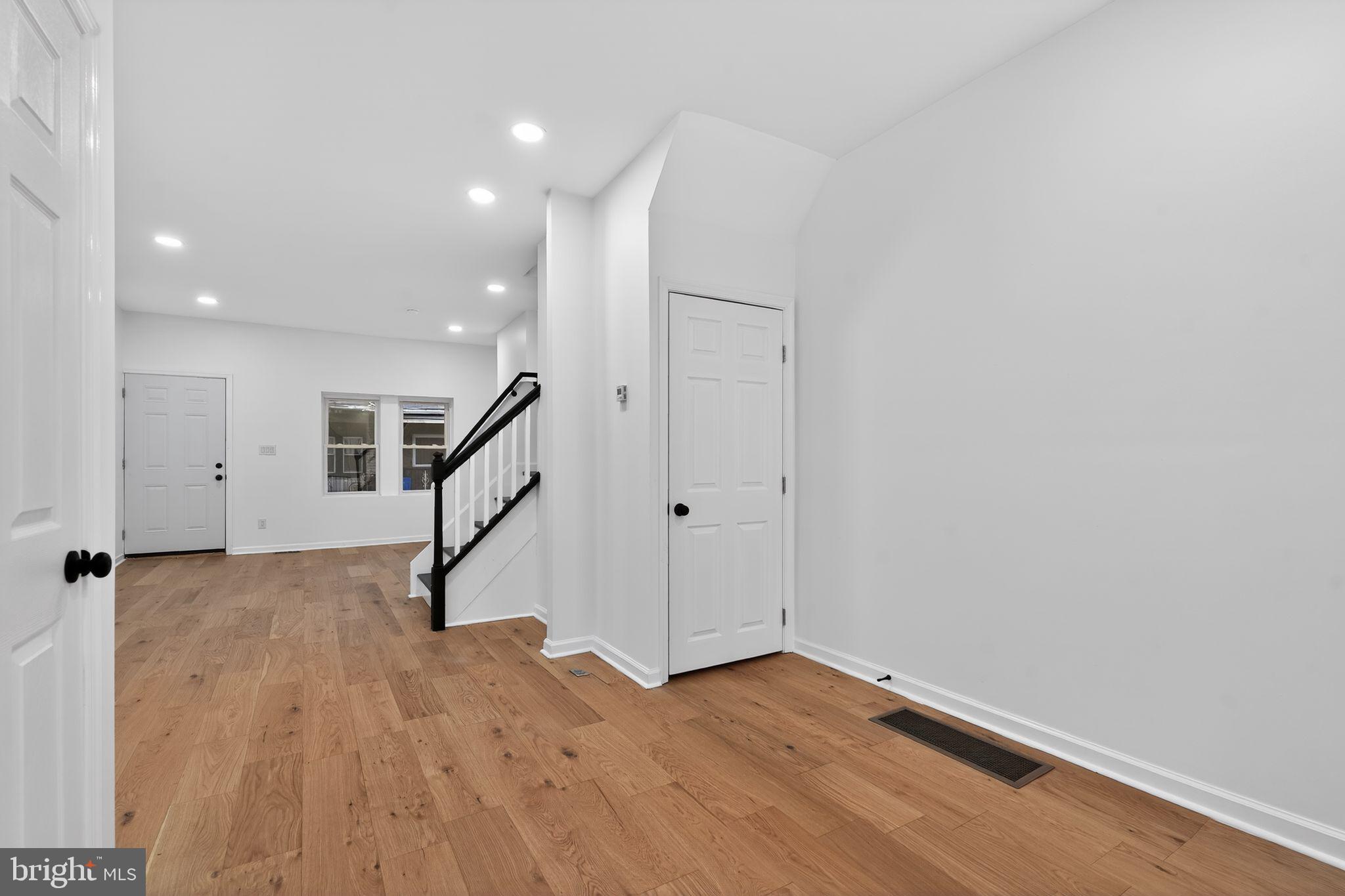 5311 Upland Street Philadelphia, PA 19143 - Photo 2 of 31 a view of an empty room with wooden floor and stairs