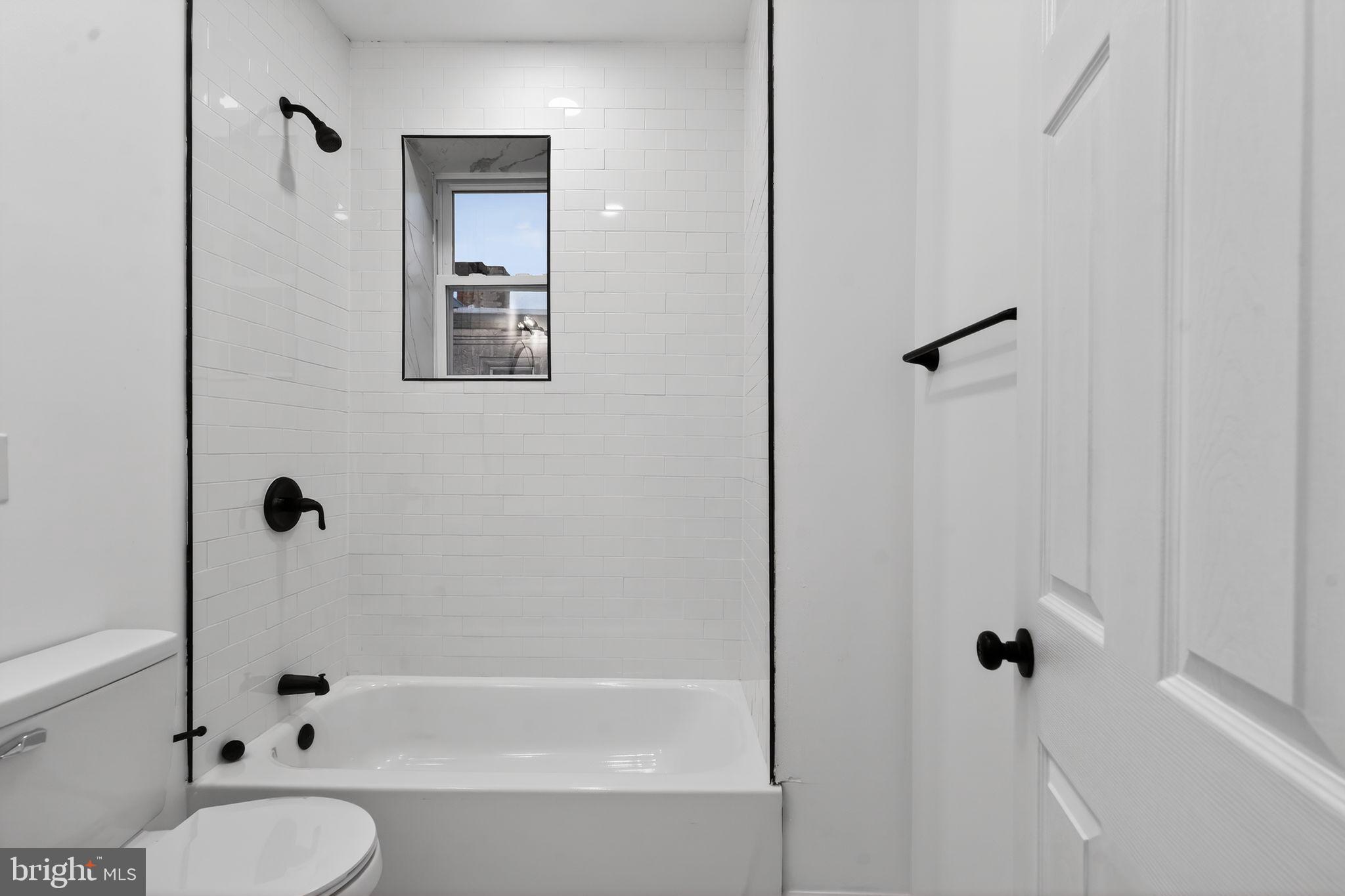 5311 Upland Street Philadelphia, PA 19143 - Photo 3 of 31 a bathroom with a sink toilet and shower