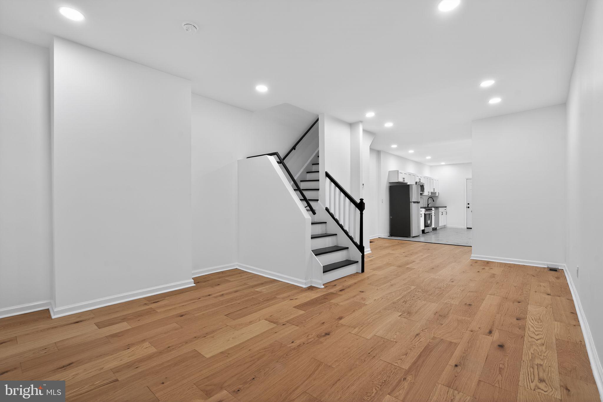 5311 Upland Street Philadelphia, PA 19143 - Photo 5 of 31 a view of a room with wooden floor and stairs