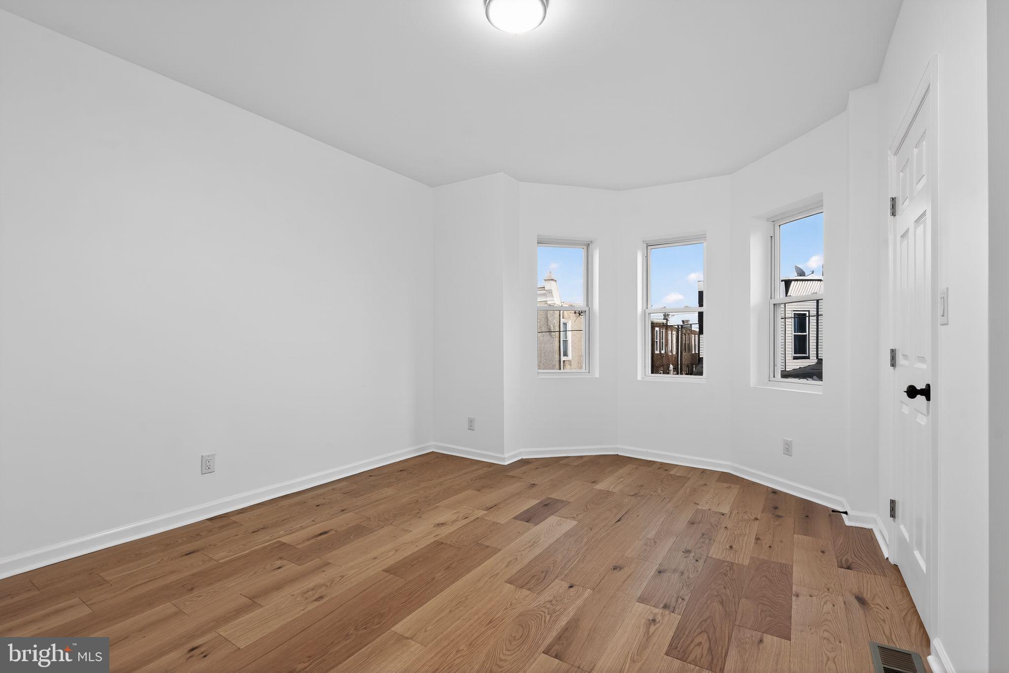 5311 Upland Street Philadelphia, PA 19143 - Photo 7 of 31 a view of empty room with wooden floor