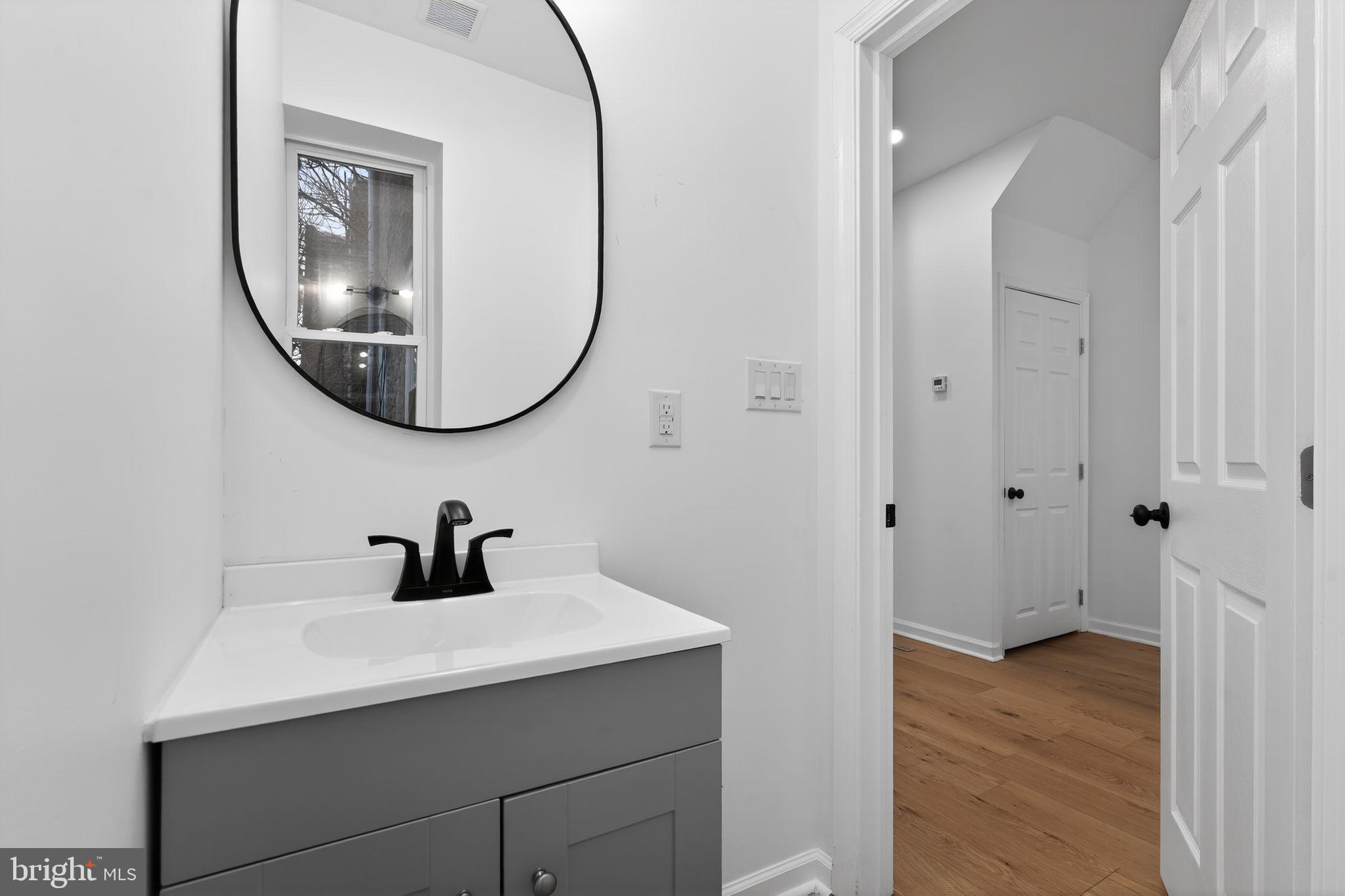 5311 Upland Street Philadelphia, PA 19143 - Photo 9 of 31 a bathroom with a sink and a mirror