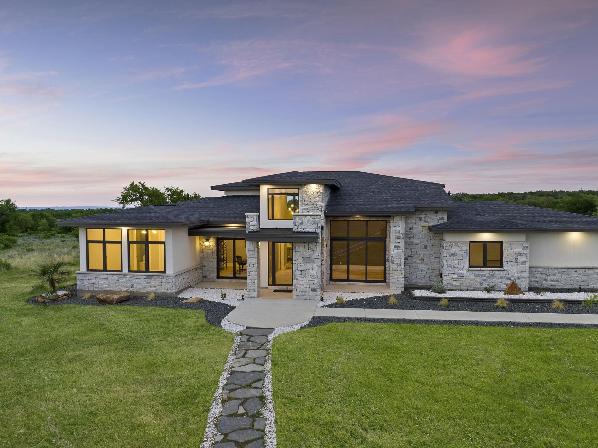a front view of house with yard and outdoor seating
