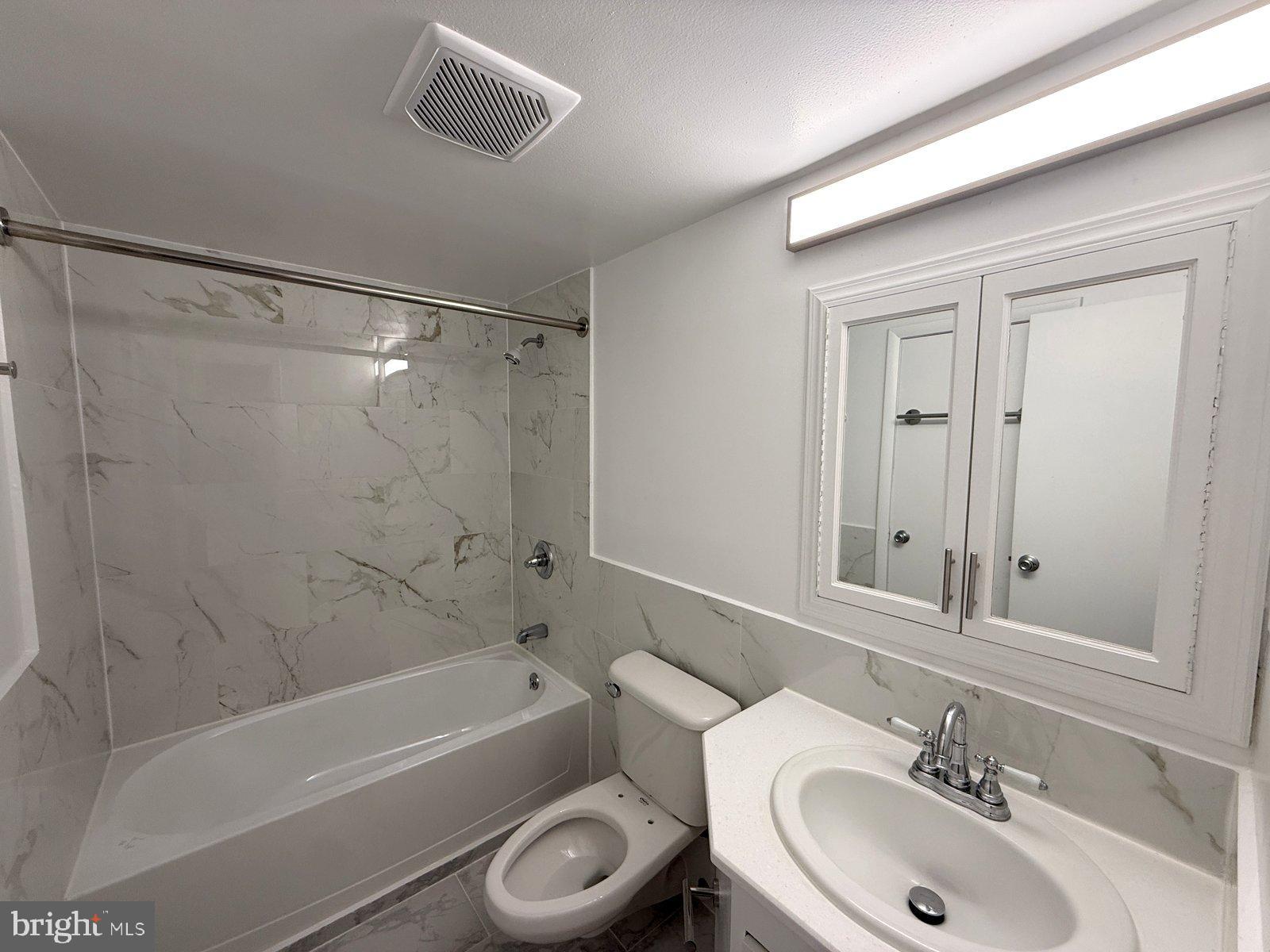 606 Cooper Landing Road, Unit B6L Cherry Hill, NJ 08002 - Photo 12 of 14 a bathroom with a sink a toilet and a bathtub